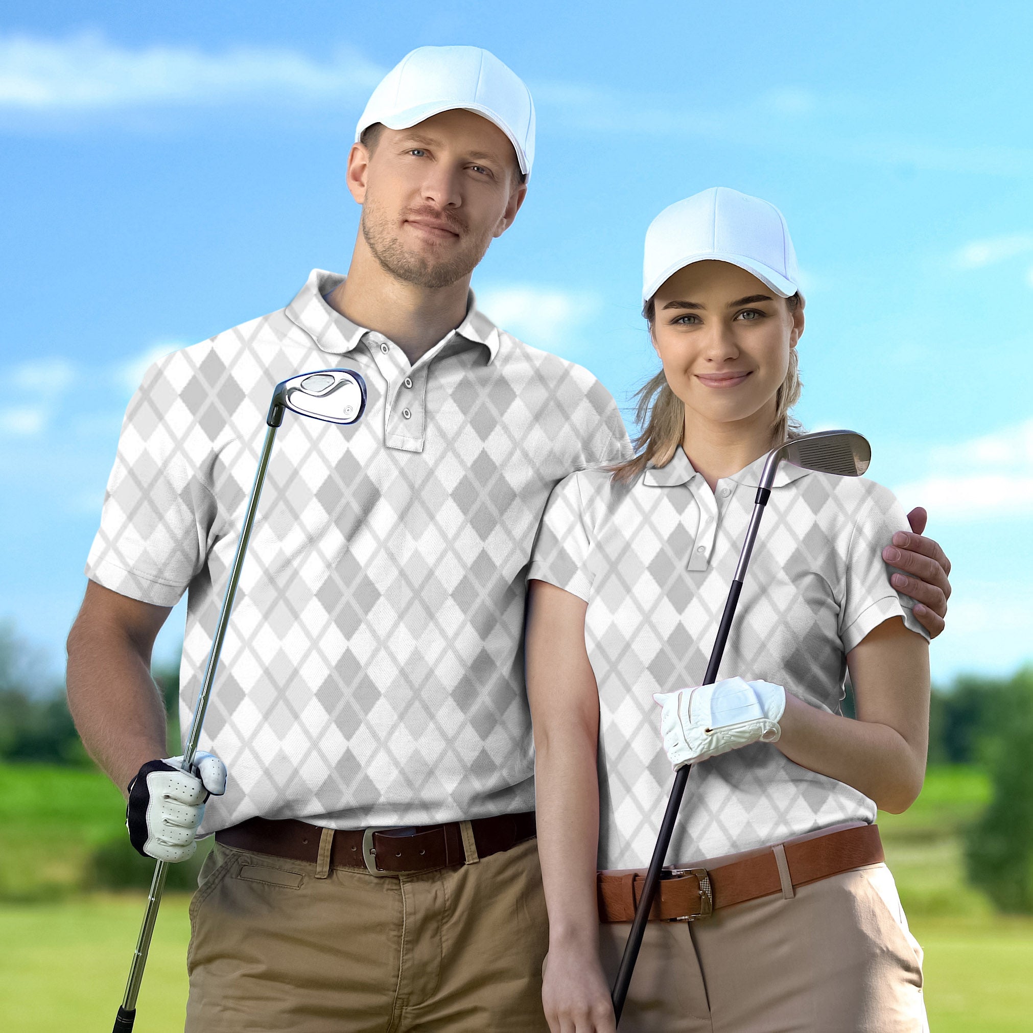 Couple wearing Argyle grey grid golf shirts holding clubs on course