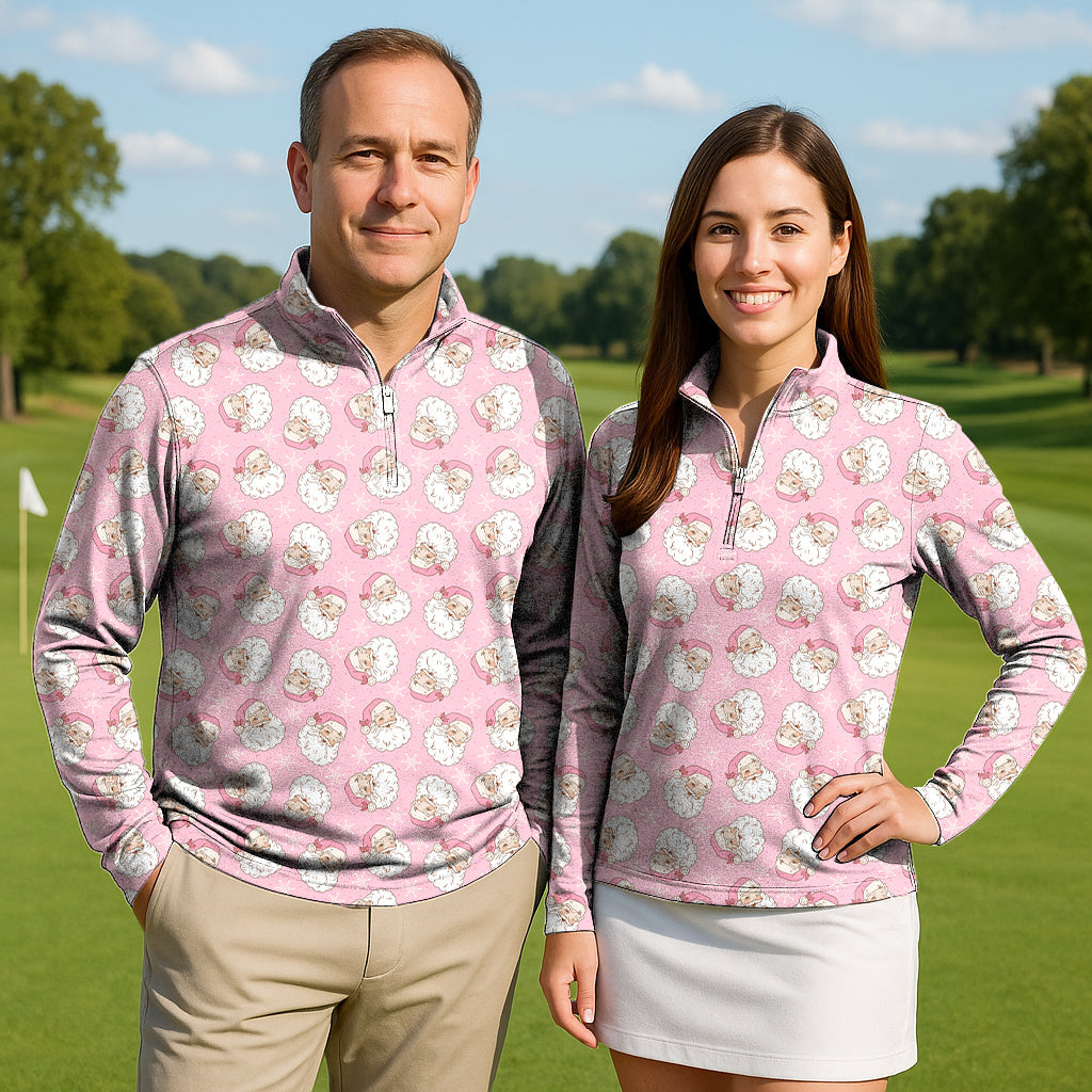 Santa Claus Christmas couple wearing pink golf active 3/4 zip tops with Santa face pattern on a golf course