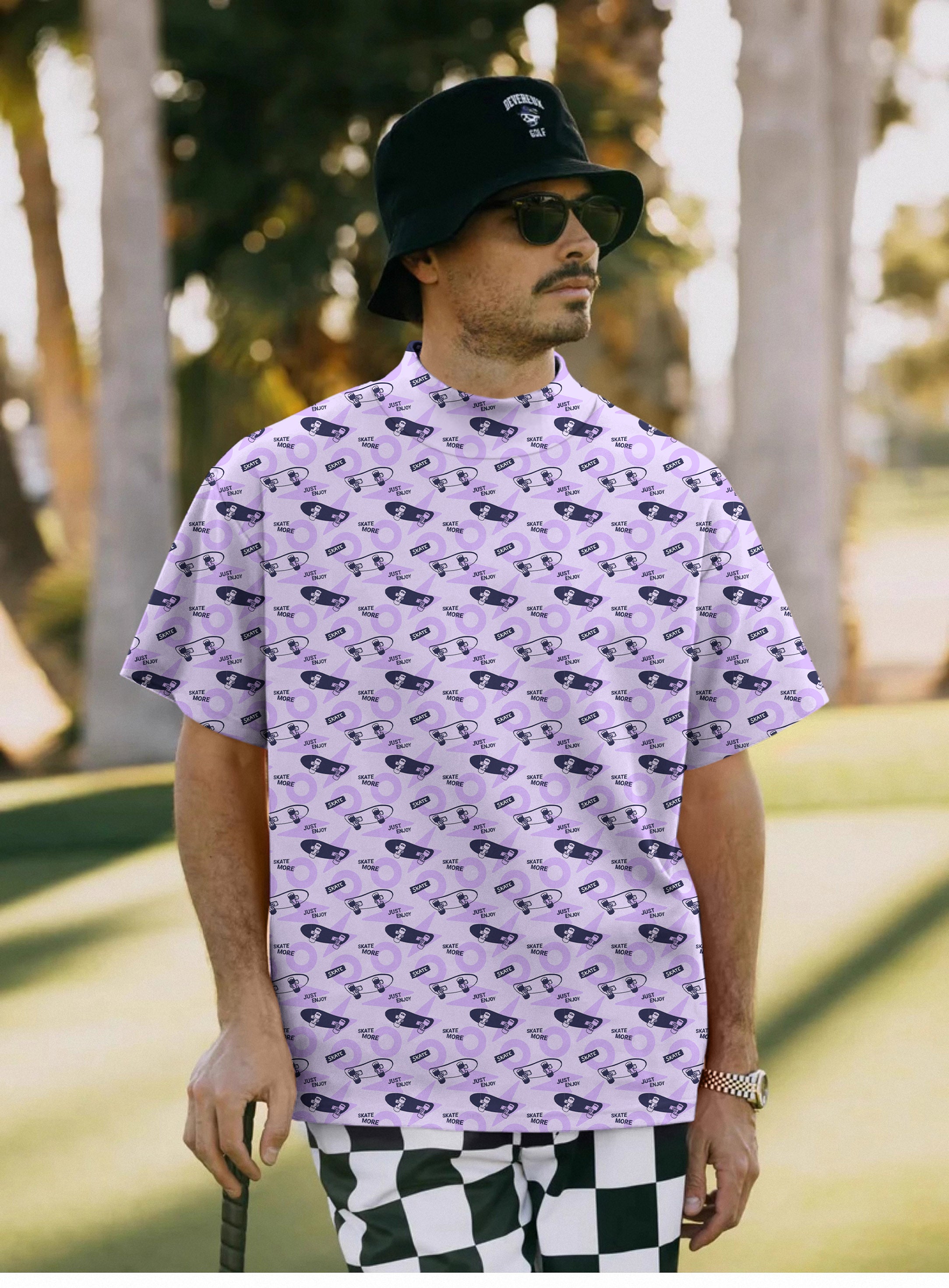Men's purple Skate More pullover T-shirt with skate pattern, high neck, and short sleeves worn by man outdoors
