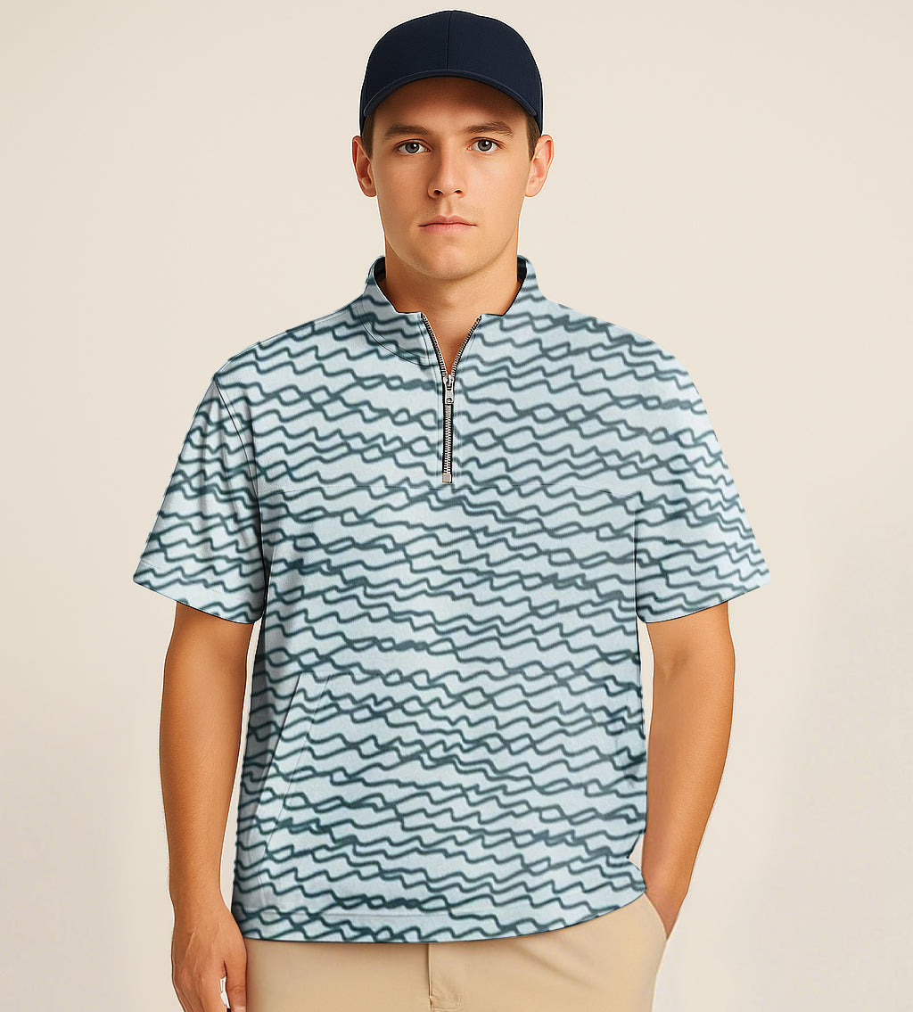 Man wearing green half zipper turtleneck golf shirt with irregular wavy line embroidery and navy cap