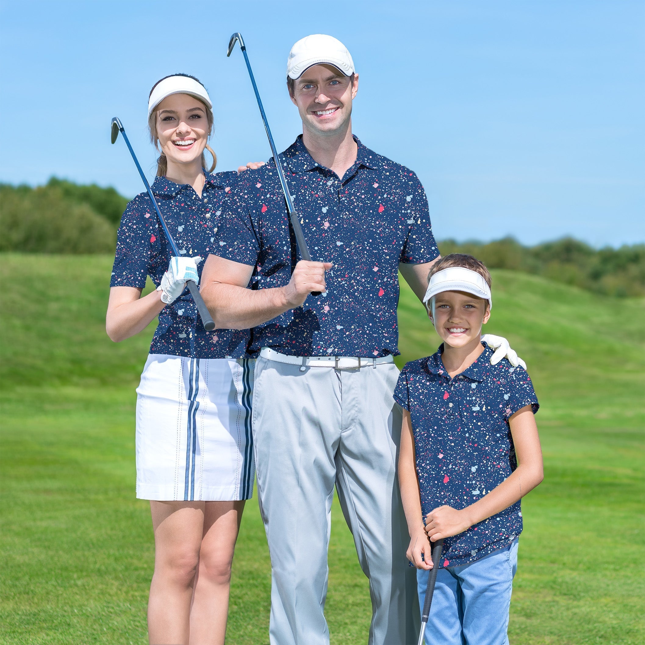 Family wearing matching navy blue ink dots golf shirts on a sunny golf course