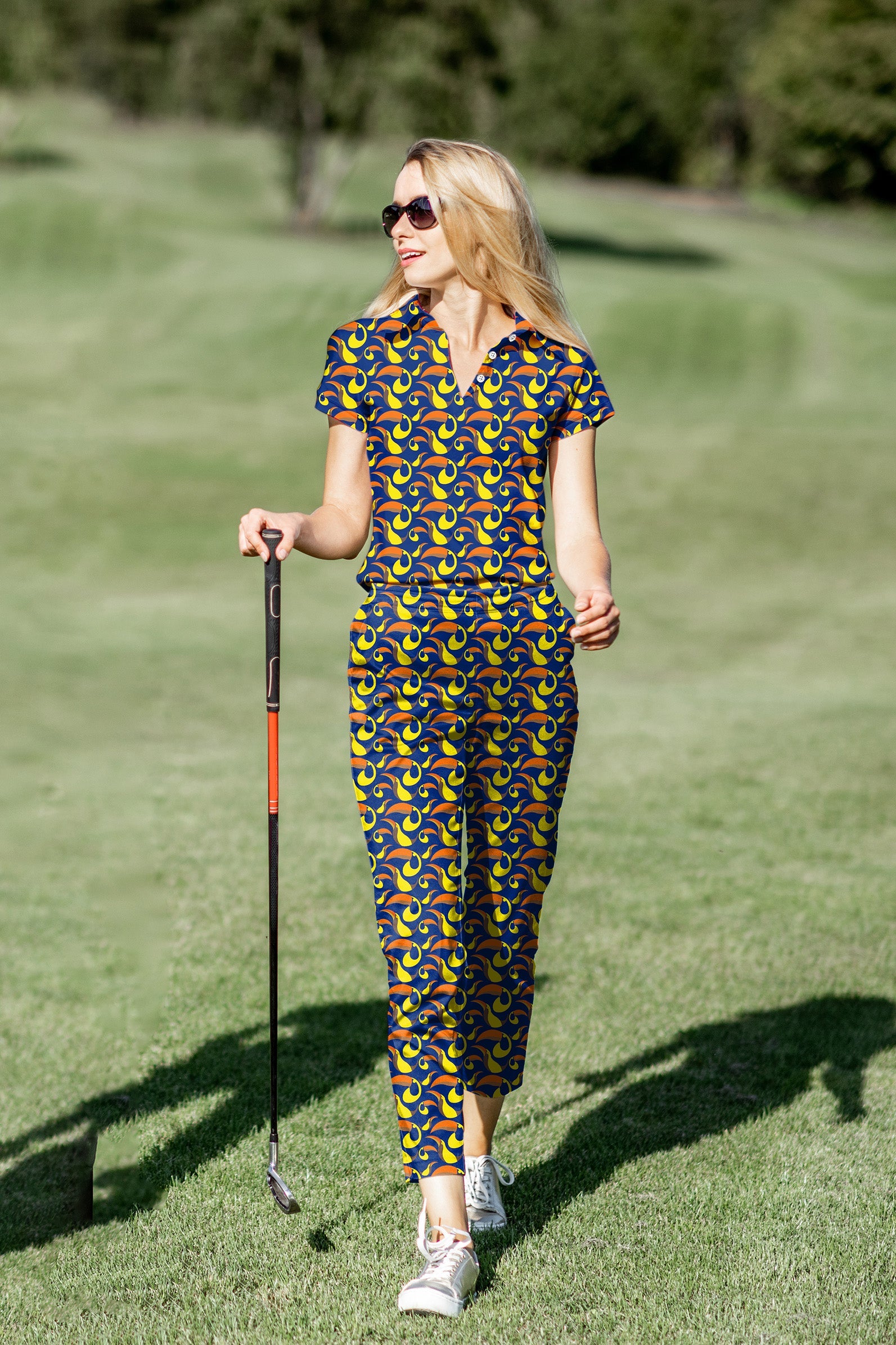 Women's golf polo and pants set with toucan print, stretchy, moisture-wicking, wrinkle-resistant, UPF 40+ protection, and classic fit.