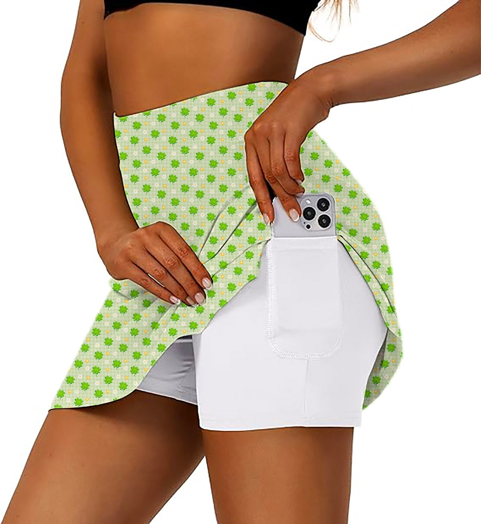 Women's athletic golf skorts with leaf clover print and phone pocket for St. Patrick's Day