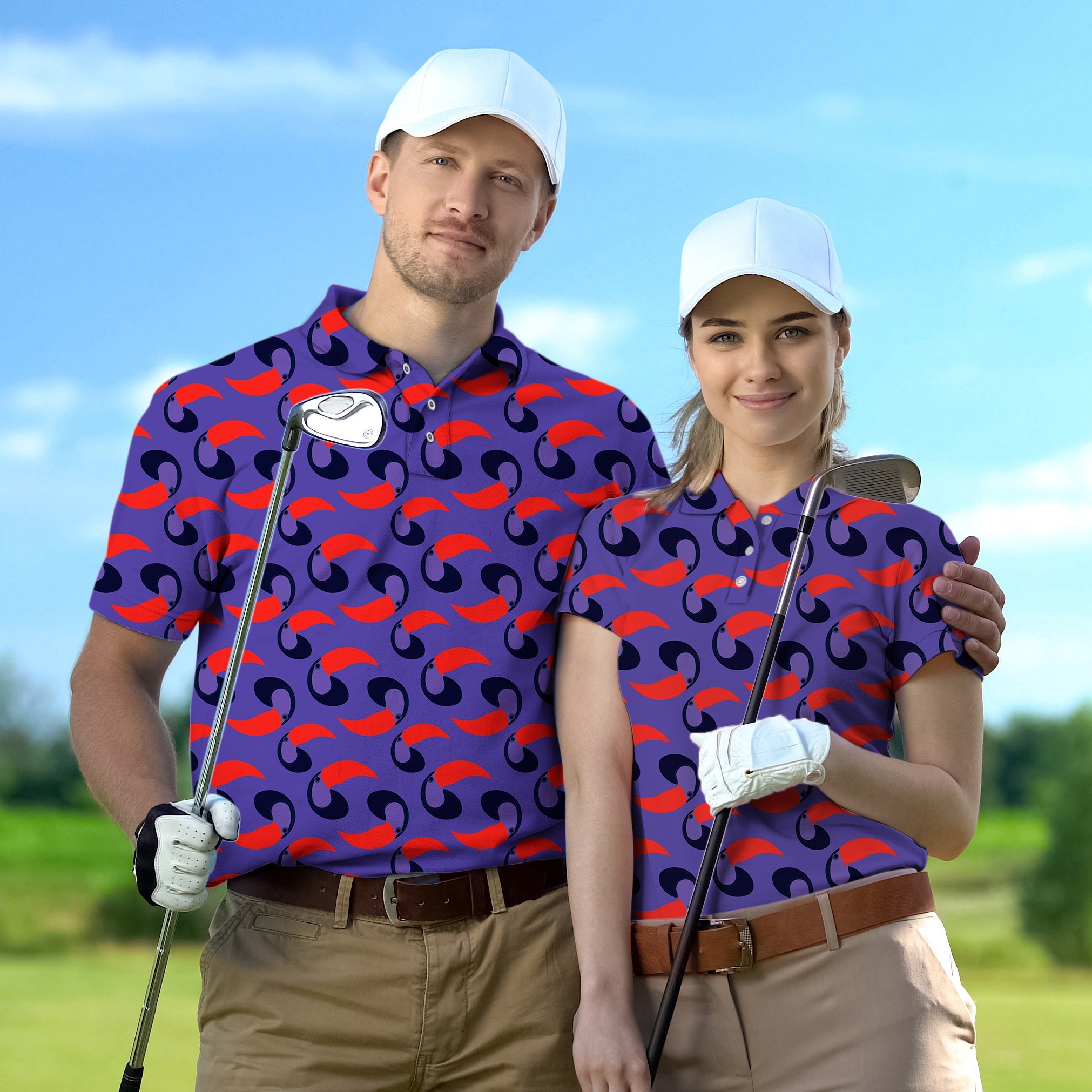 Couple wearing matching purple toucan print golf shirts holding clubs on golf course