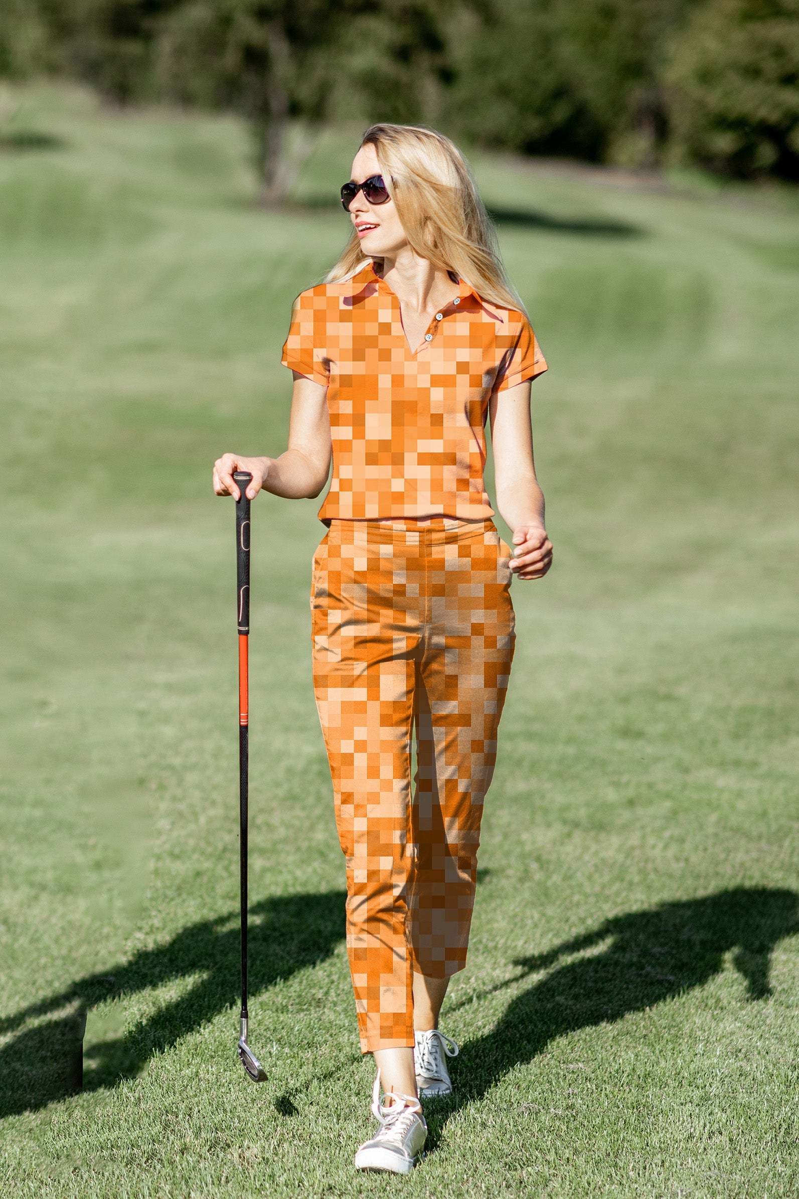 Women's Golf Polo+Pants Set in orange pixel pattern with four-way stretch and UPF 40+ protection for comfortable, stylish golf wear