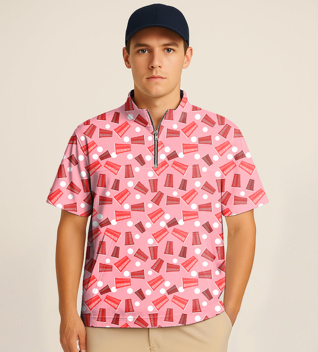 Man wearing pink half zipper turtleneck golf short shirt with drinkers cup embroidery pattern