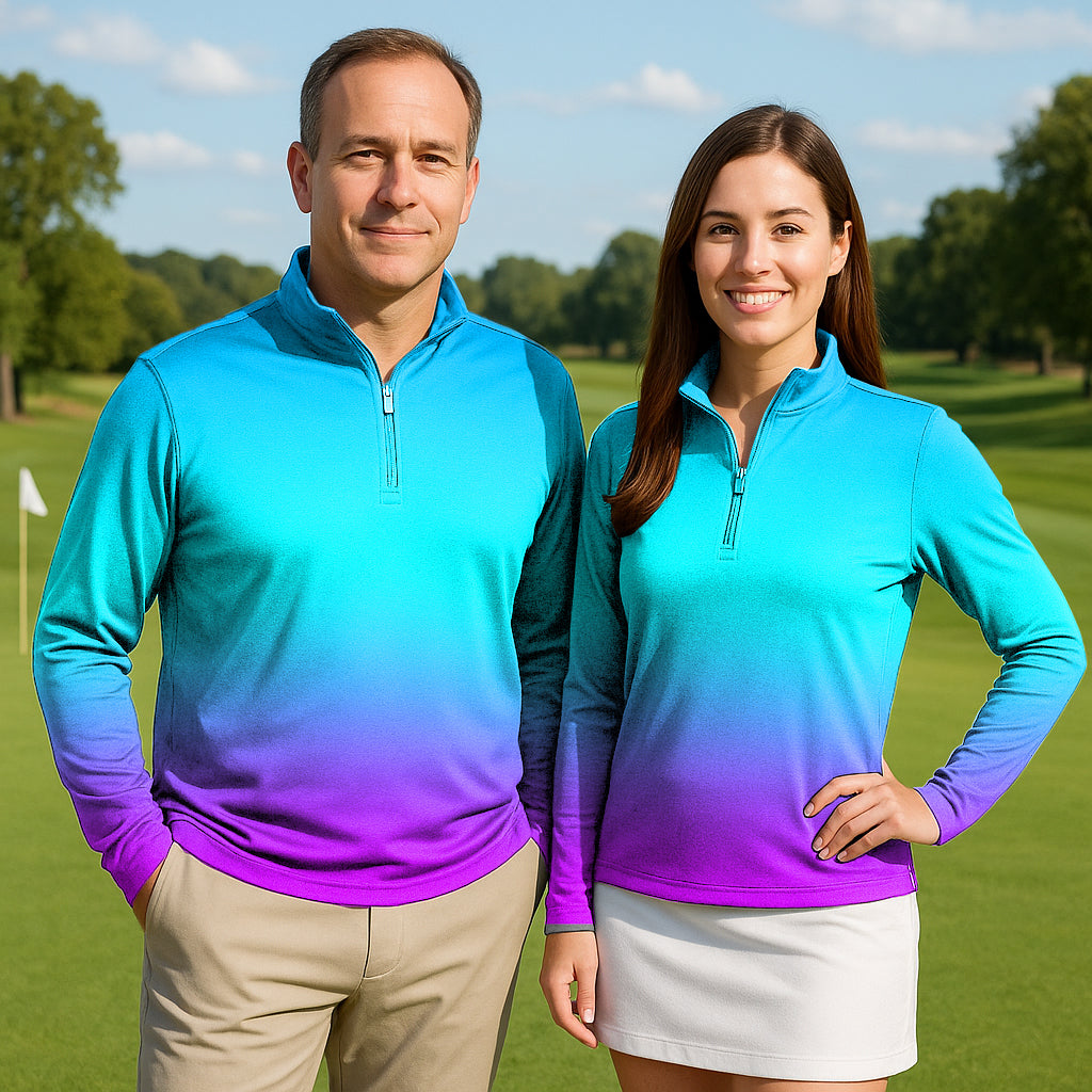 Couple wearing neon gradients 3/4 zip golf tops on a golf course