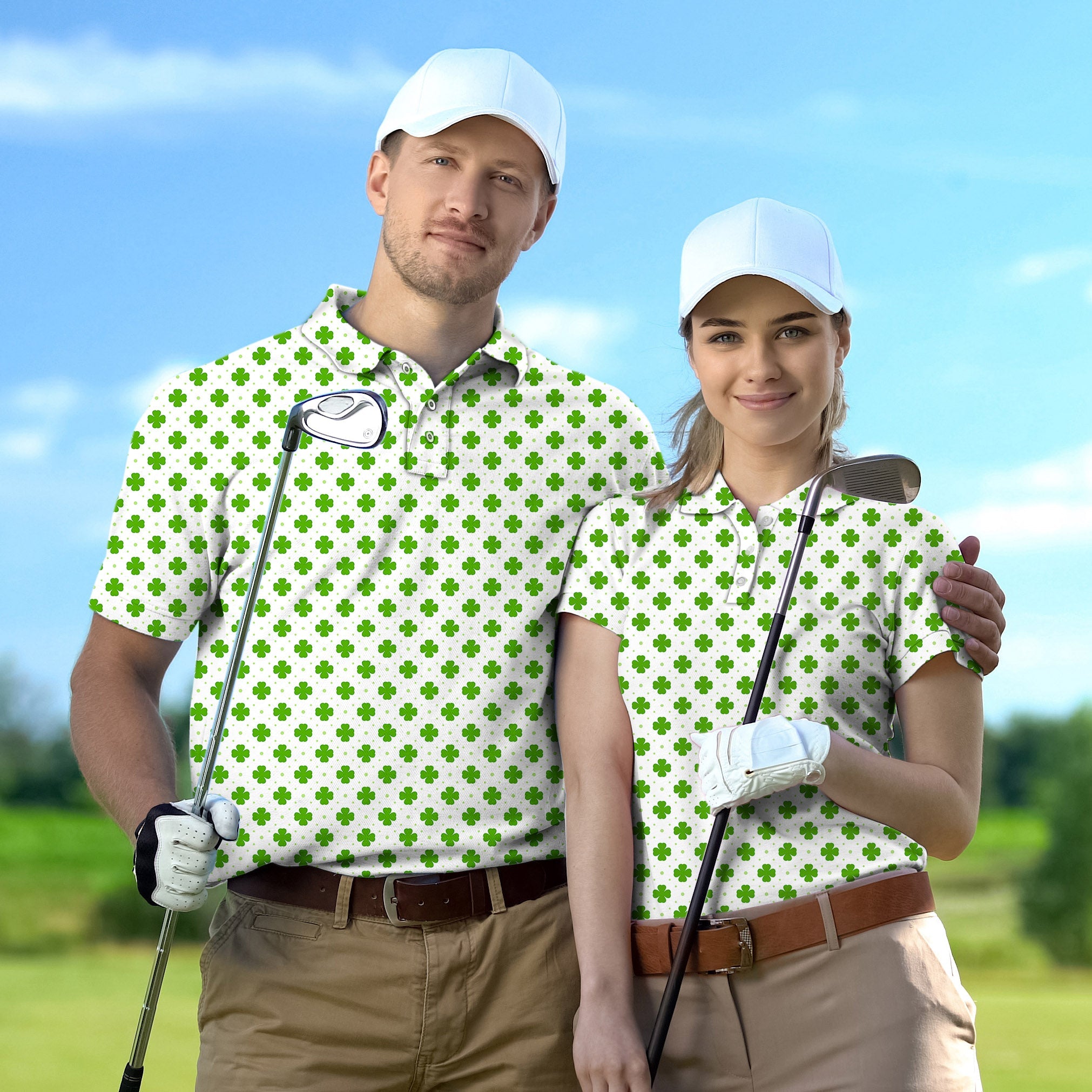 Golf polo couple wearing white caps and matching green leaf clover patterned shirts holding golf clubs on a sunny golf course