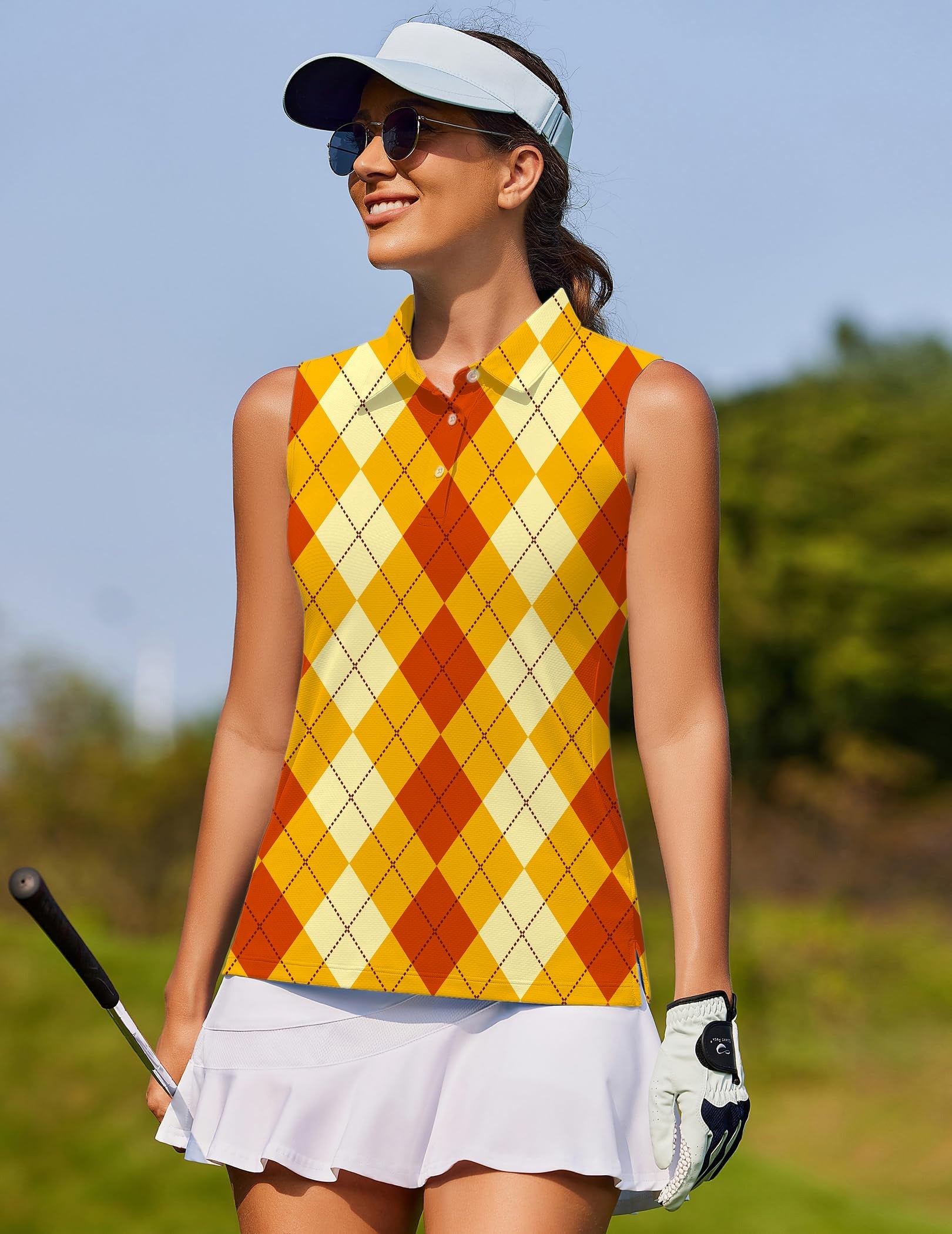 Woman wearing Halloween light yellow red argyle sleeveless golf shirt with white visor and skirt on golf course