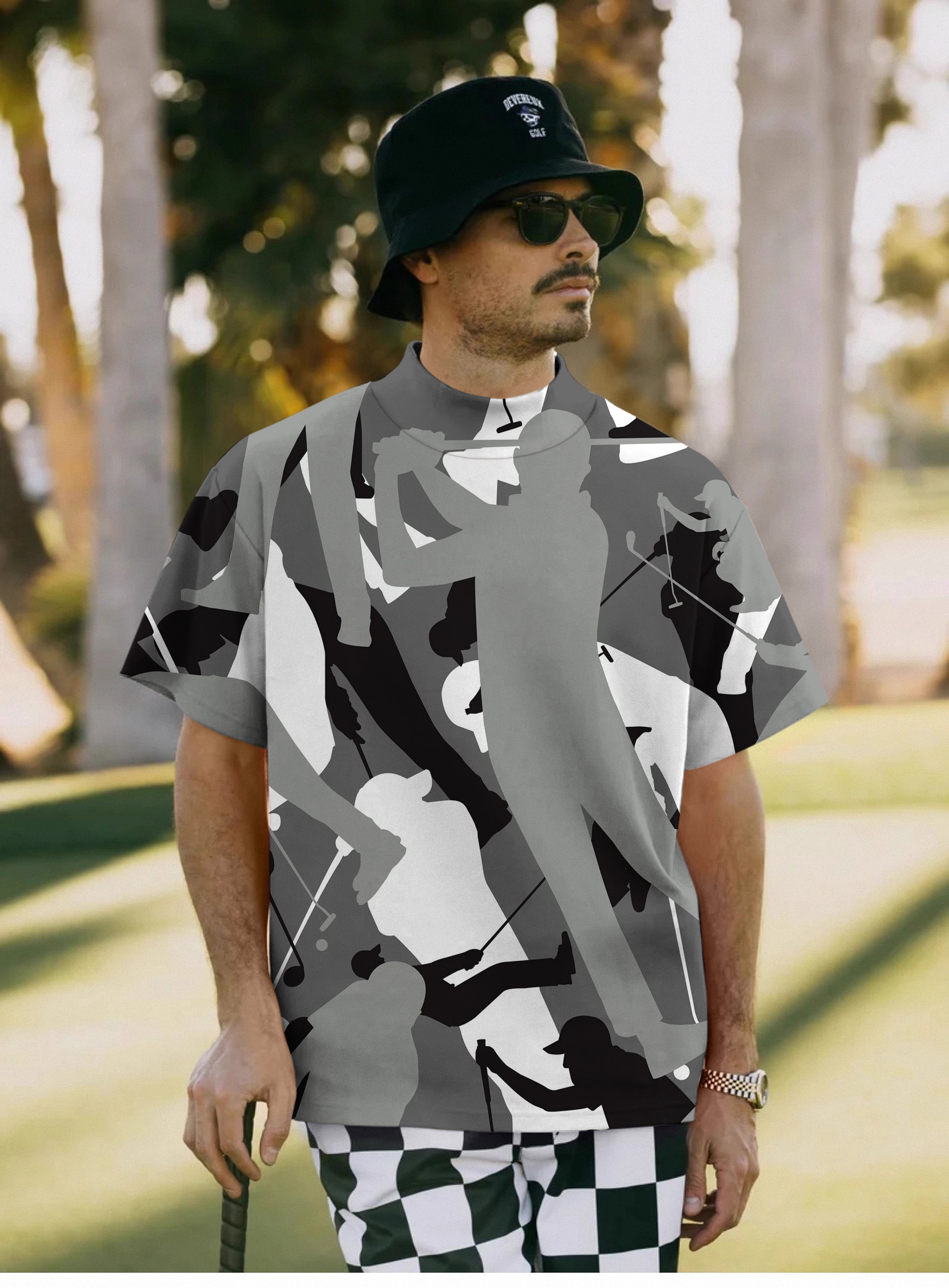 Men's black and white golf pullover with golf player silhouettes and high neck design