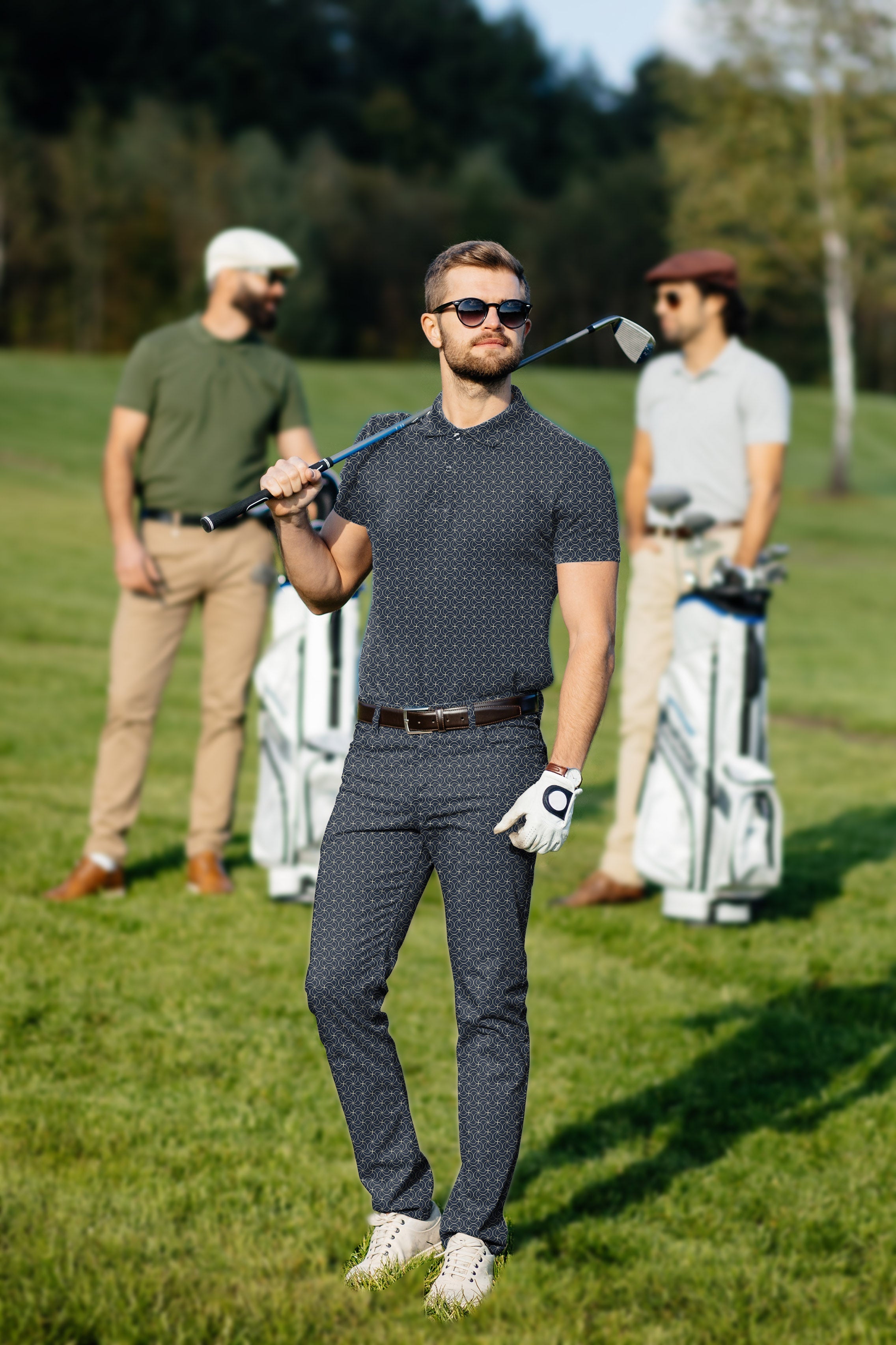 Men's navy blue floral golf set polo and pants with stretchy, moisture-wicking fabric and classic fit on a golfer at the course