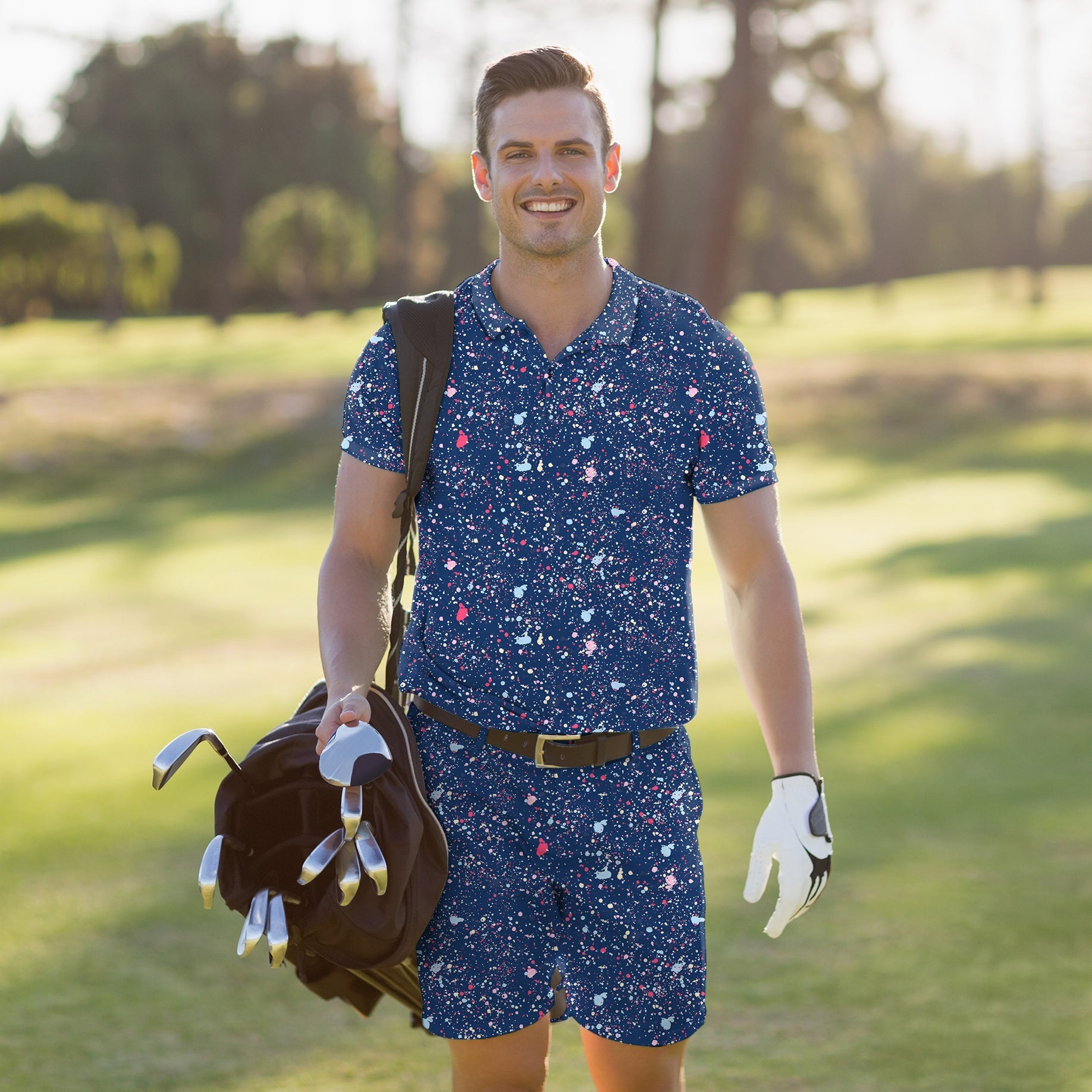Men's golf set polo and shorts in navy blue ink dots with moisture-wicking, four-way stretch, UPF 40+, and wrinkle-resistant fabric.