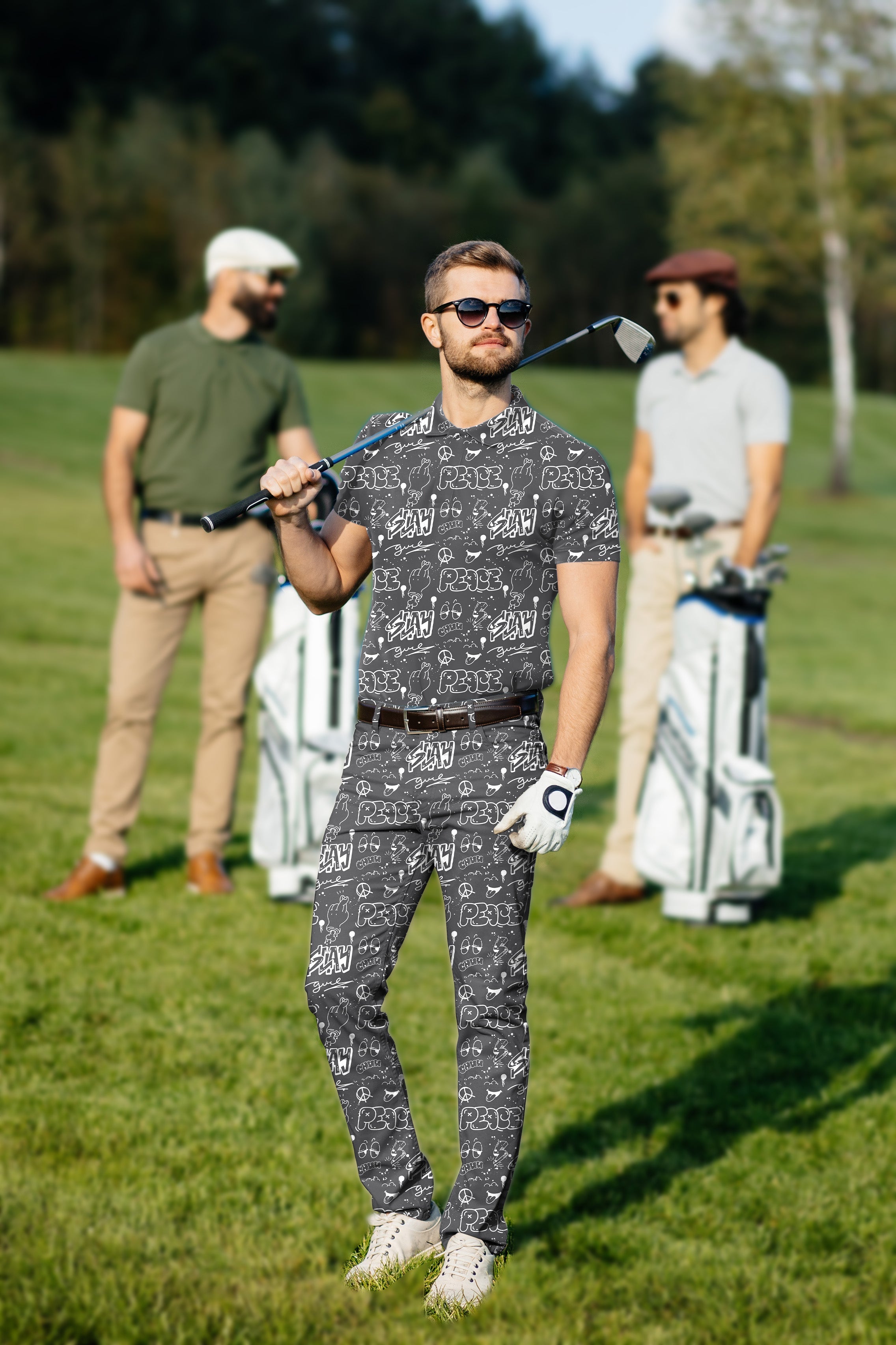 Men's golf set with gray patterned polo and pants featuring custom monograms and moisture-wicking fabric