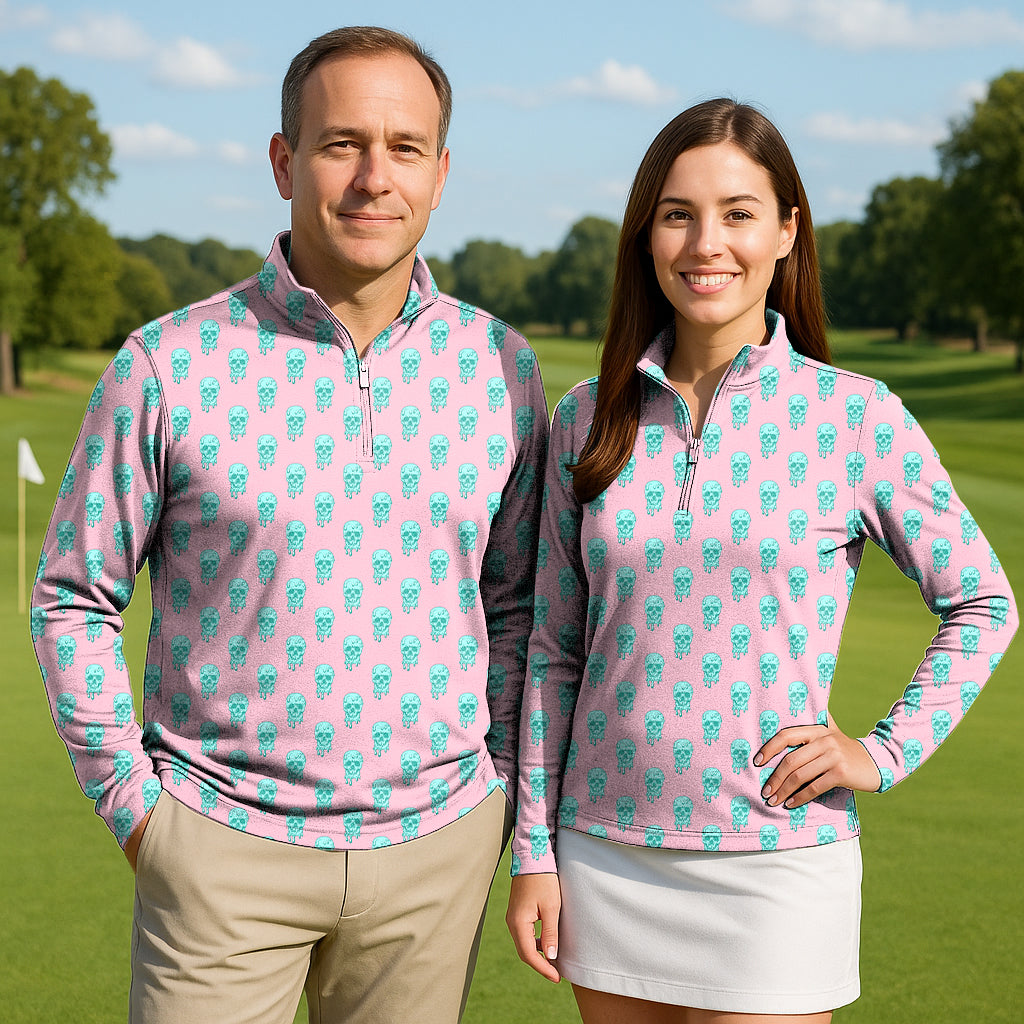 Couple wearing Dripping Skull active 3/4 zip tops with long sleeves on golf course