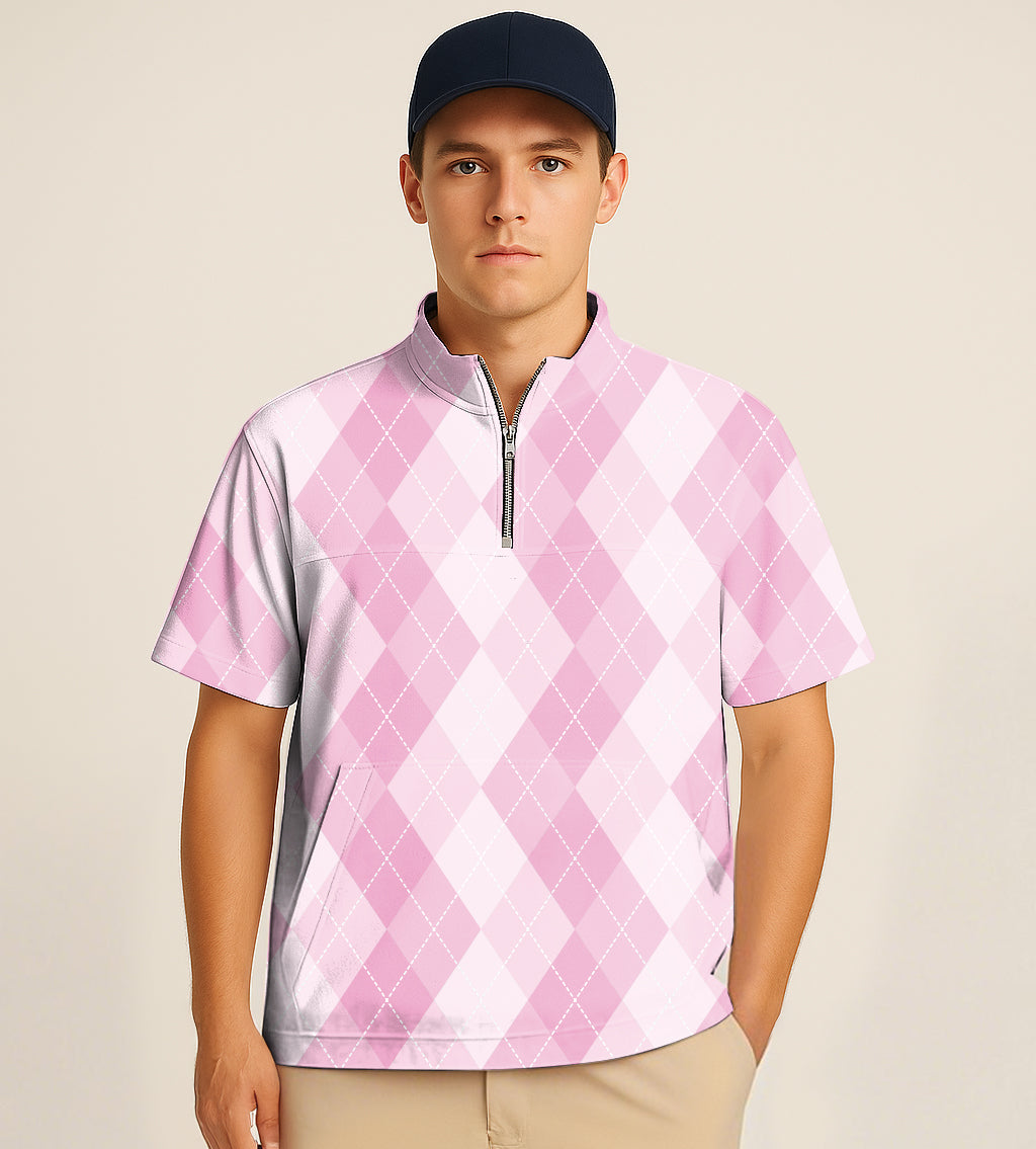 Man wearing pink argyle half zipper turtleneck golf short sleeve shirt with black cap