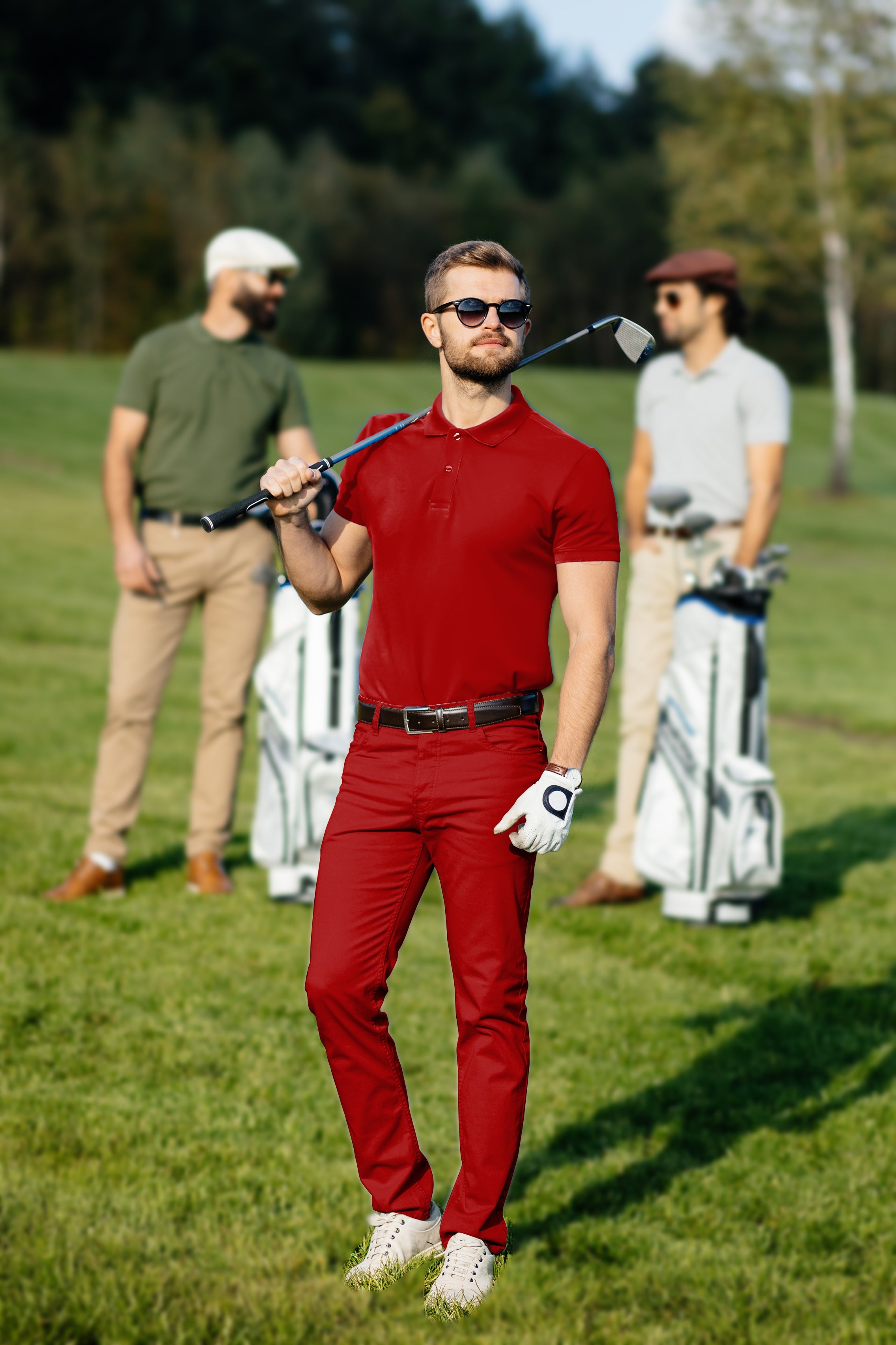 Men's golf set polo and pants in red with four-way stretch and moisture-wicking fabric on a golf course