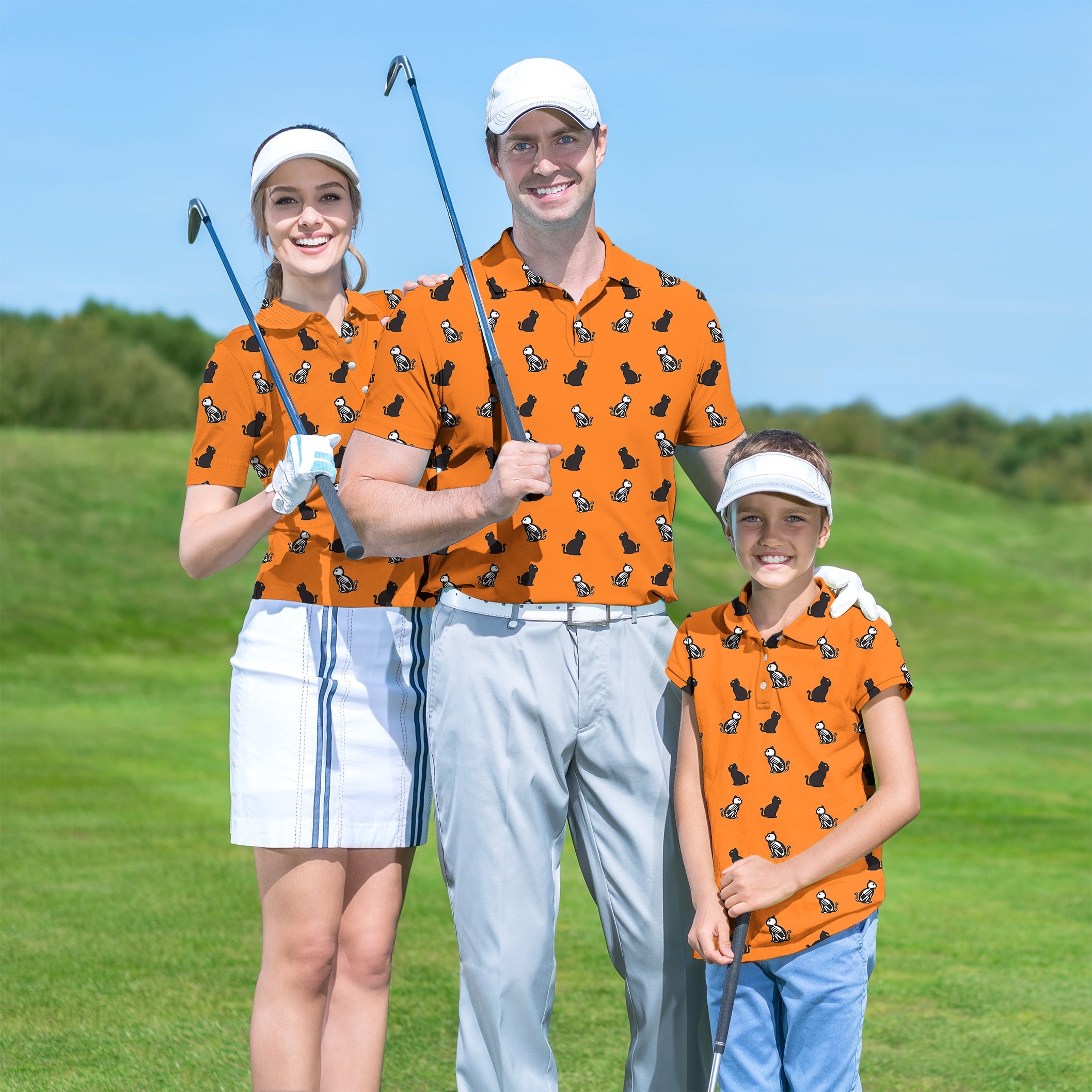 Family wearing matching orange Halloween skull print golf shirts on a sunny golf course