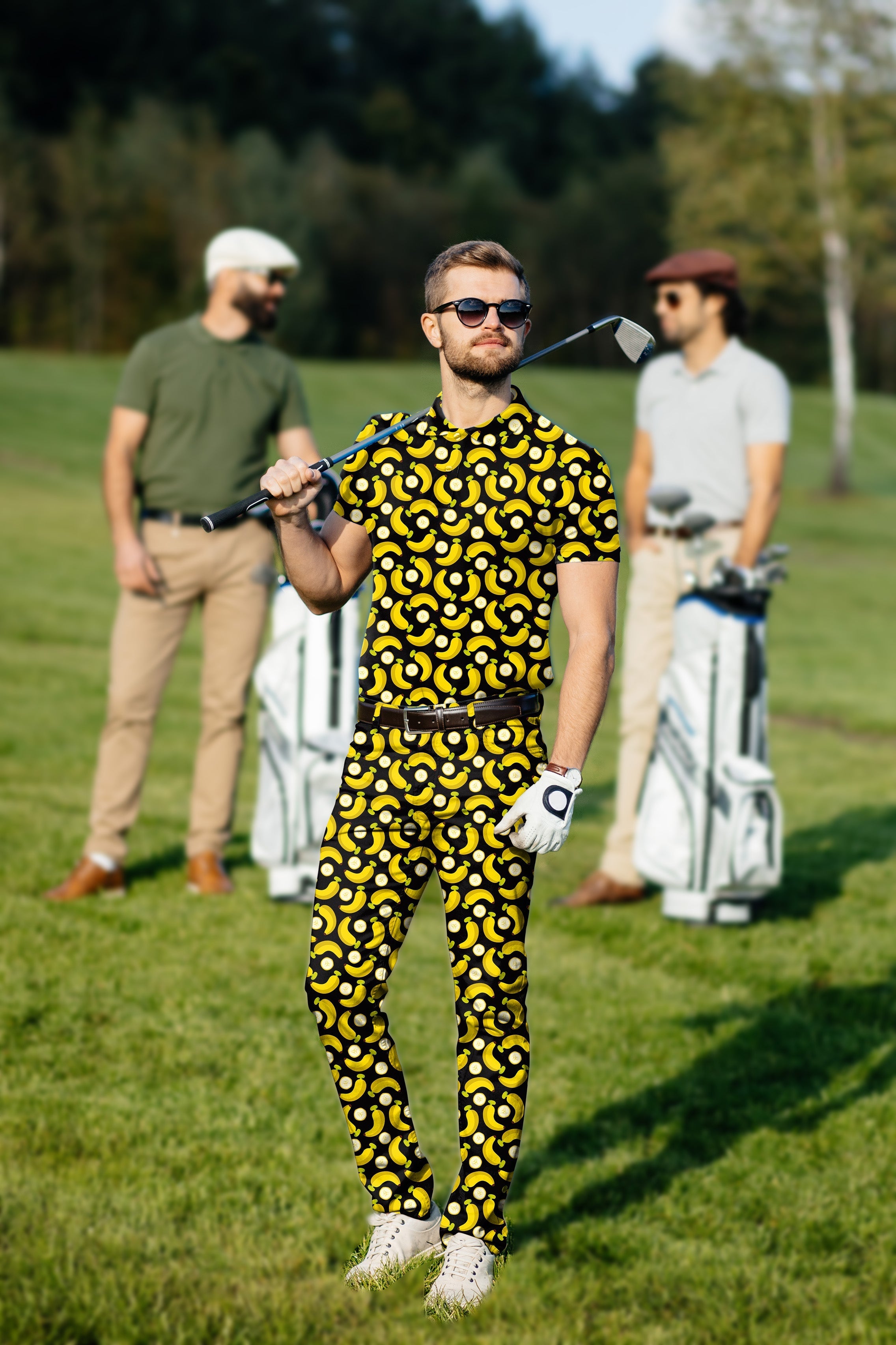 Men's golf set with yellow banana and banana peel print polo and pants on golf course