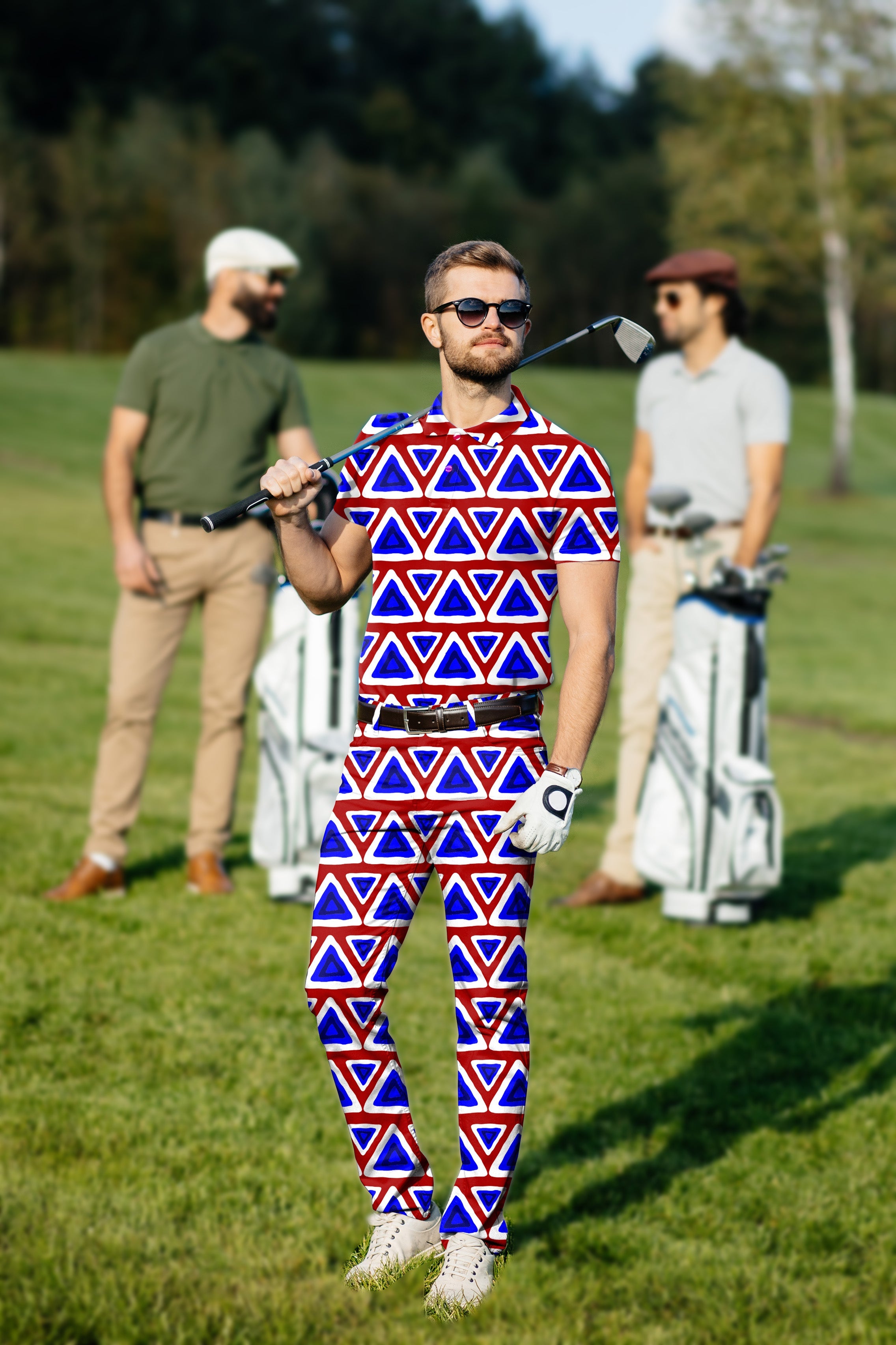 Men's golf set polo and pants with blue and red triangle tribal pattern, modeled on golf course