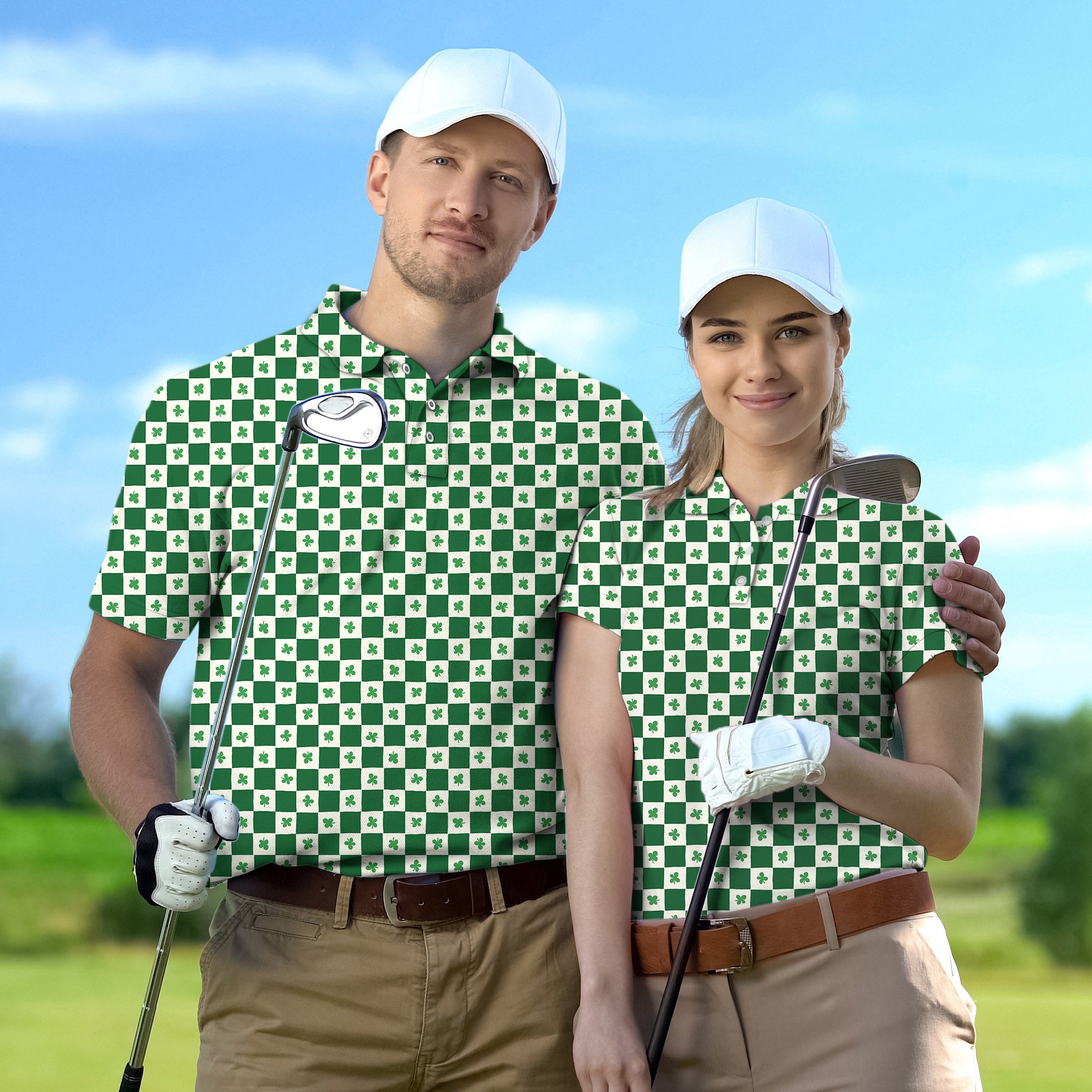 Couple wearing green and white clover-patterned golf polos with caps, holding golf clubs on a sunny golf course