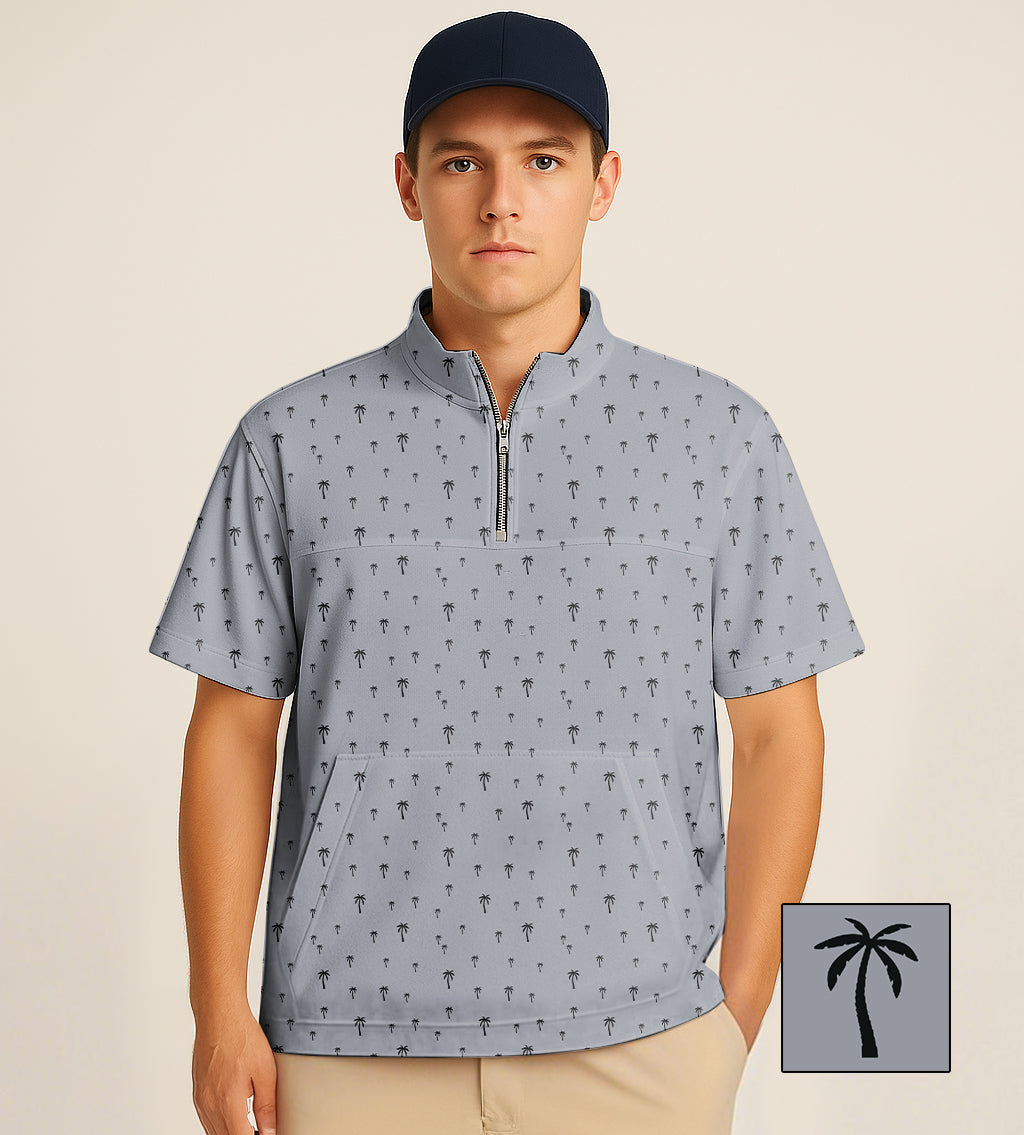 half zipper turtleneck golf shirt with coconut palm embroidery in gray worn by man with navy cap