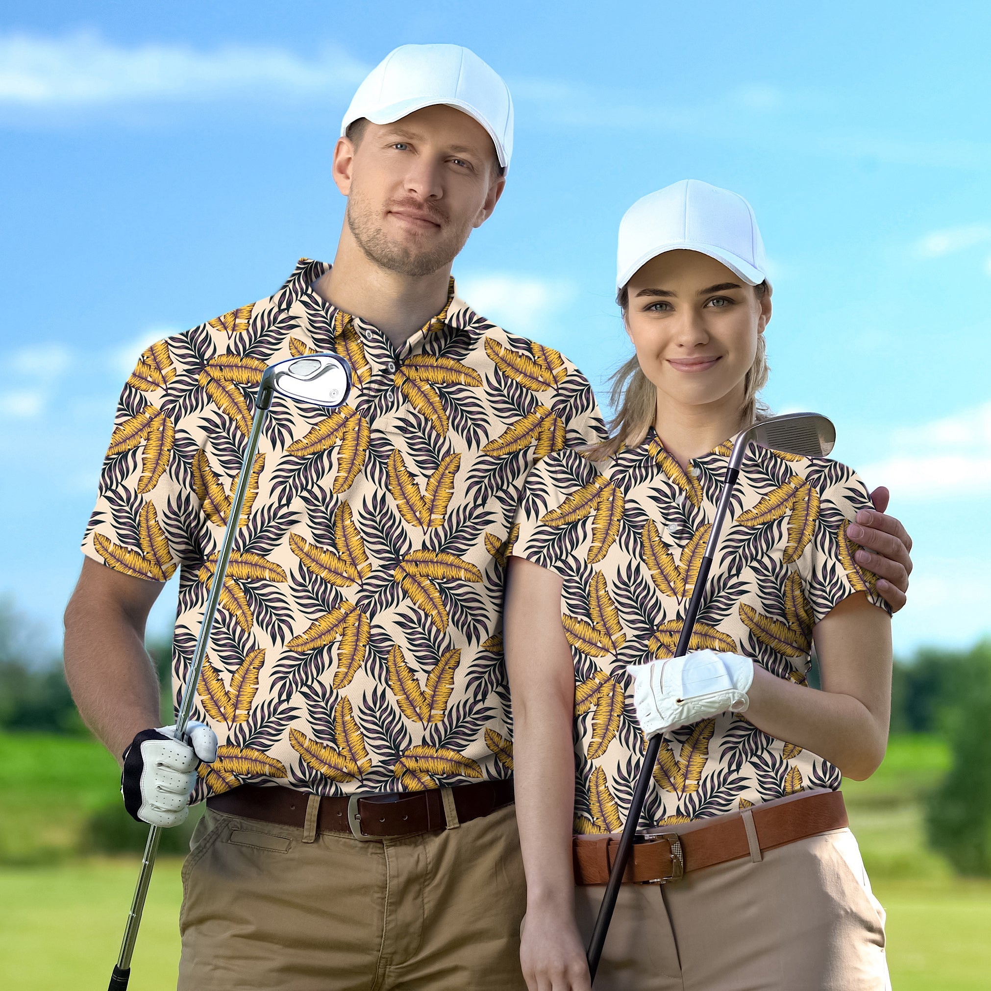 Golf Polo Couple wearing matching Golden Tropics tournament shirts with white caps on golf course