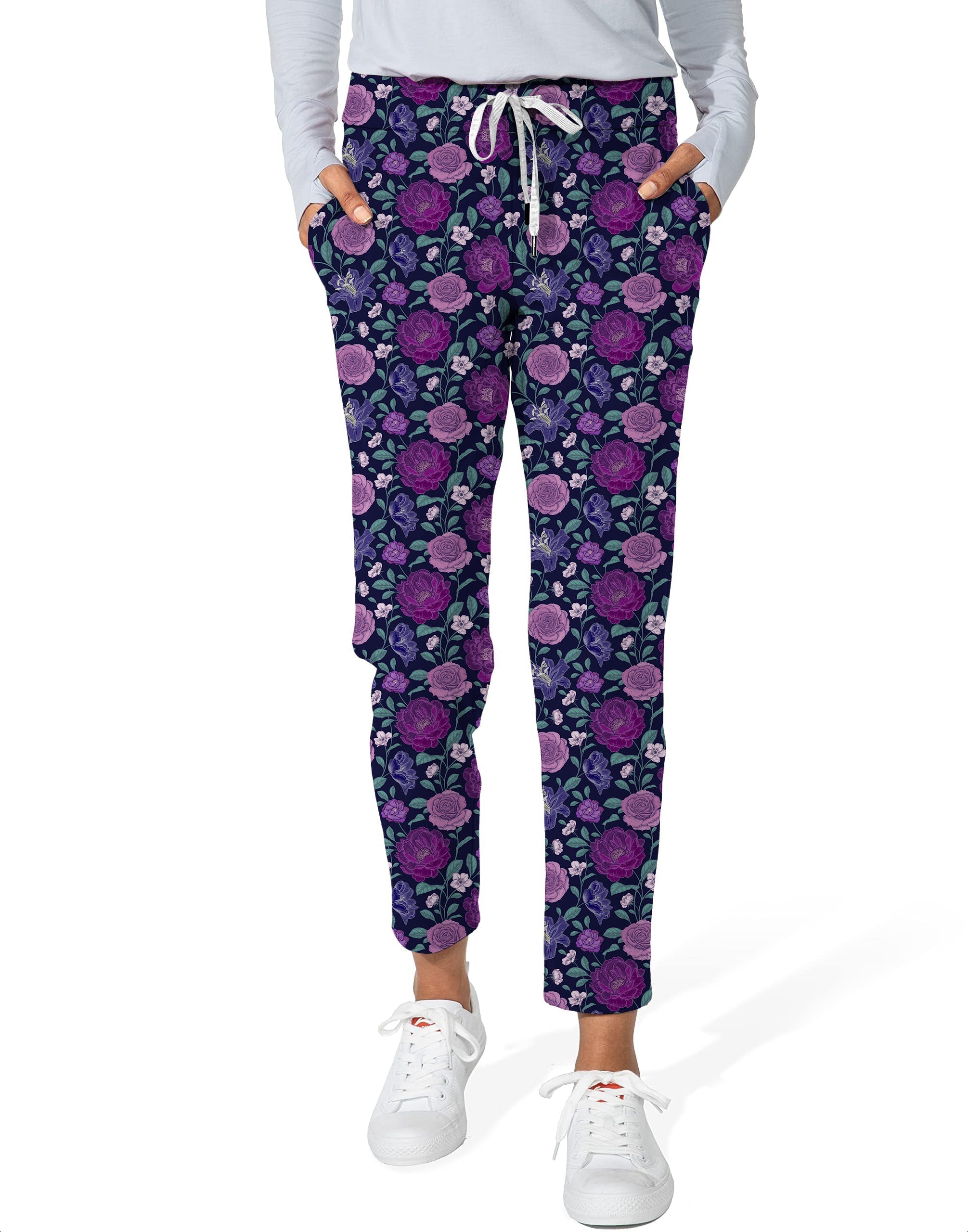 Women's purple floral 7/8 stretch ankle golf pants with drawstring waist and pockets