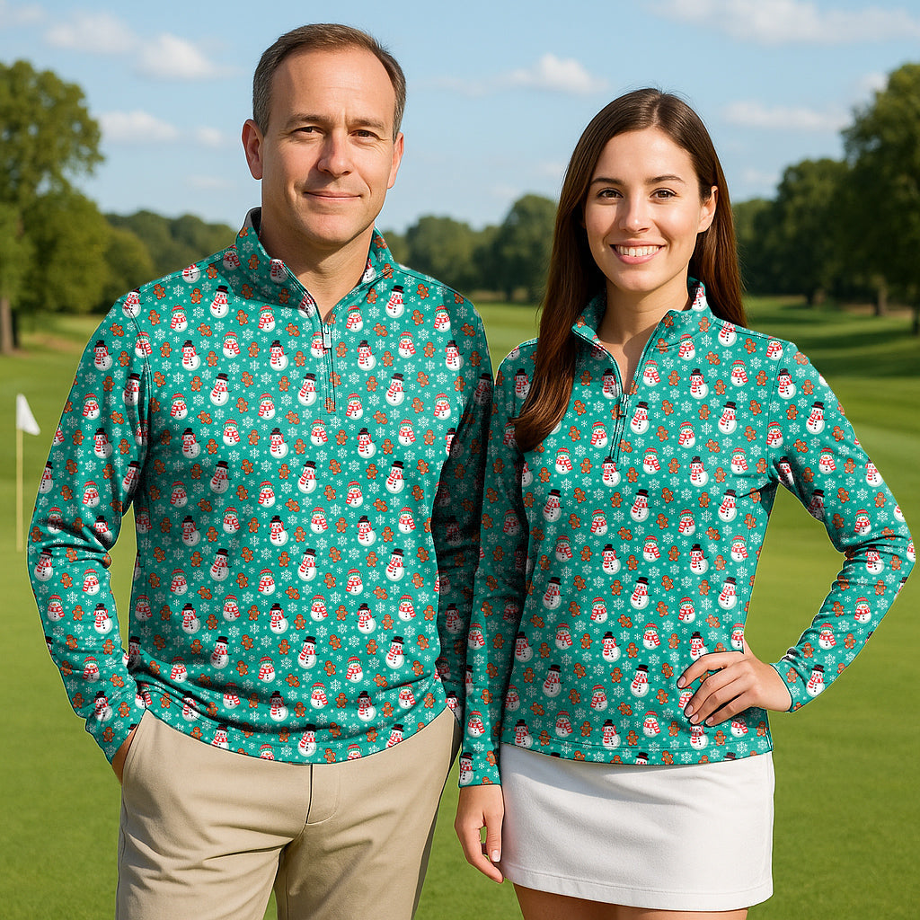 Couple wearing gingerbread snowman print blue long sleeve golf active 3/4 zip tops on golf course