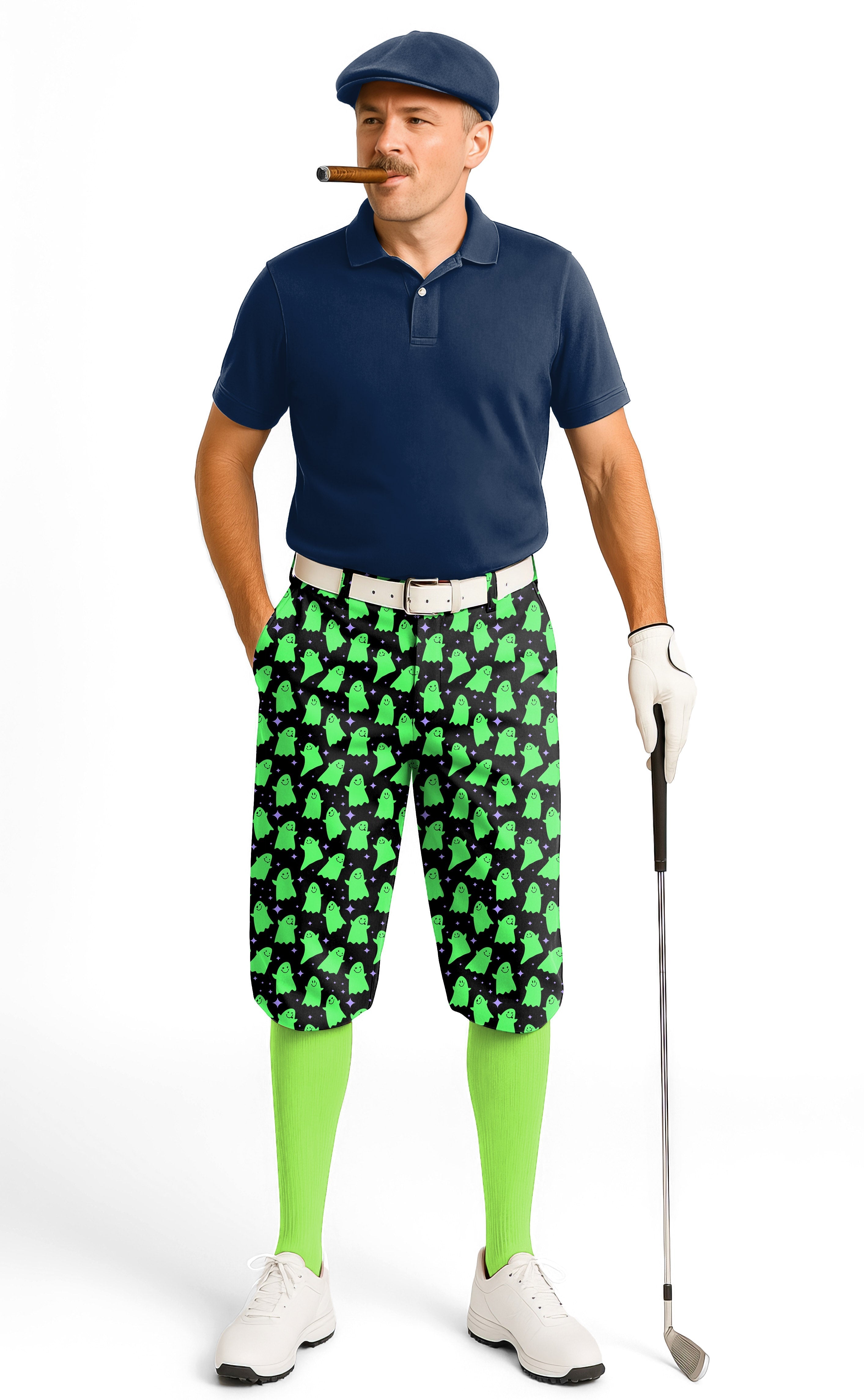 Man wearing Halloween Green Ghost men's golf knickers with green ghost pattern, navy polo, green socks, and golf glove holding a club.