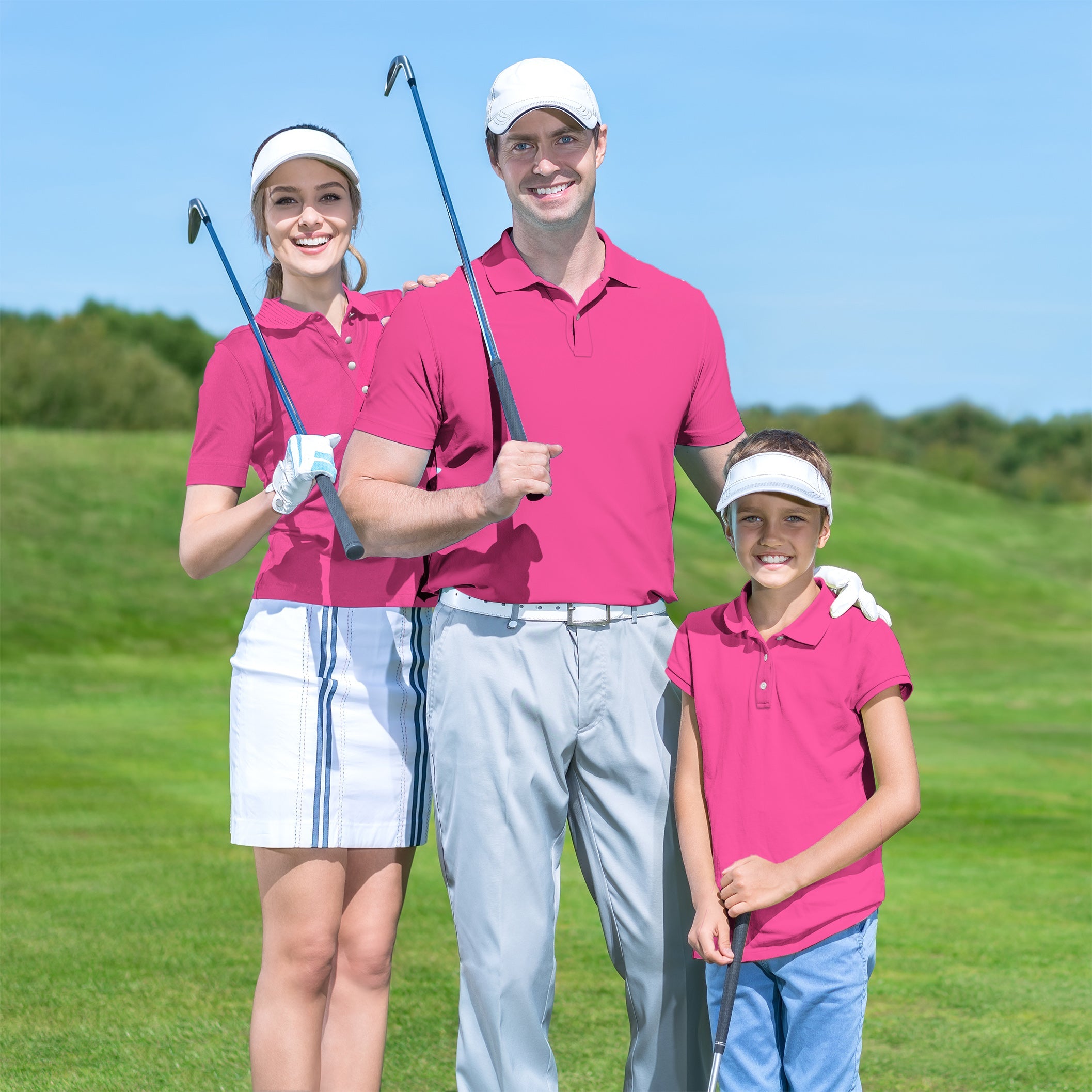 Family wearing pure fuchsia set golf attire on golf course holding clubs