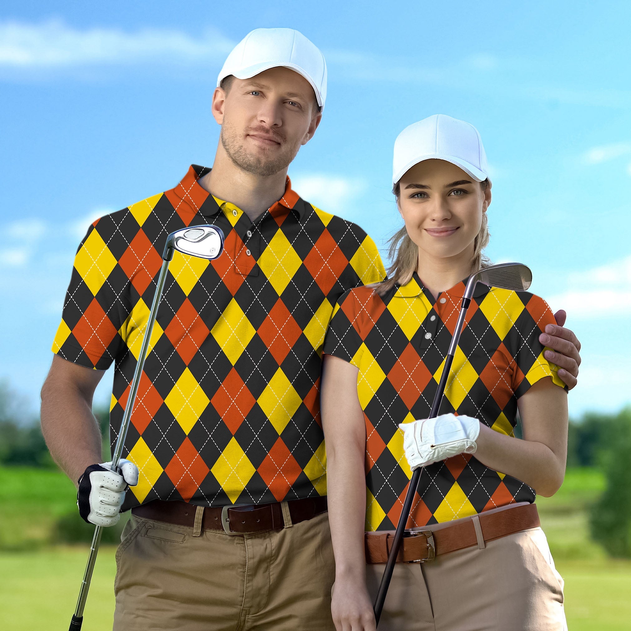 Couple wearing red argyle set golf shirts holding clubs on golf course