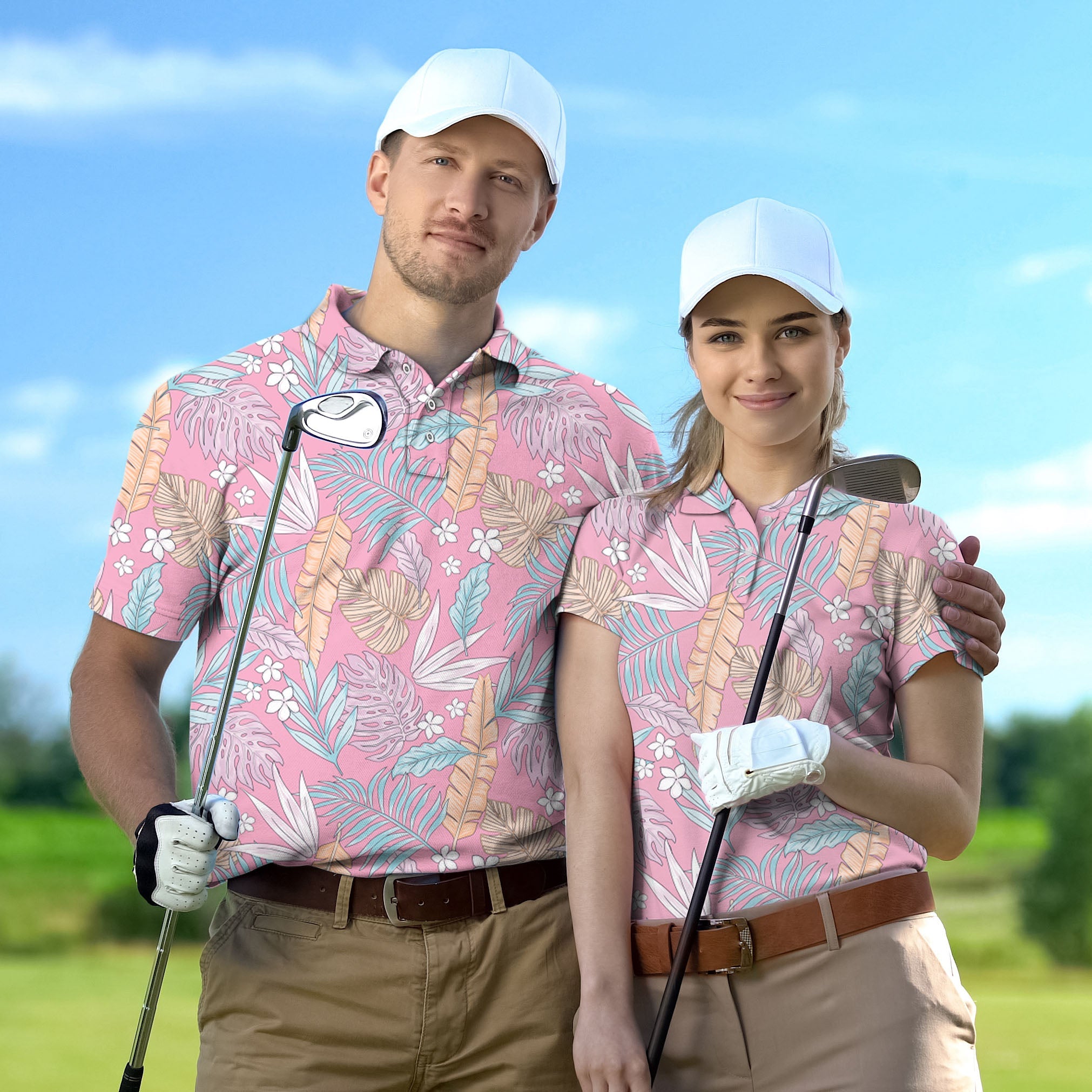 Couple wearing matching floral print golf polos with white caps on golf course