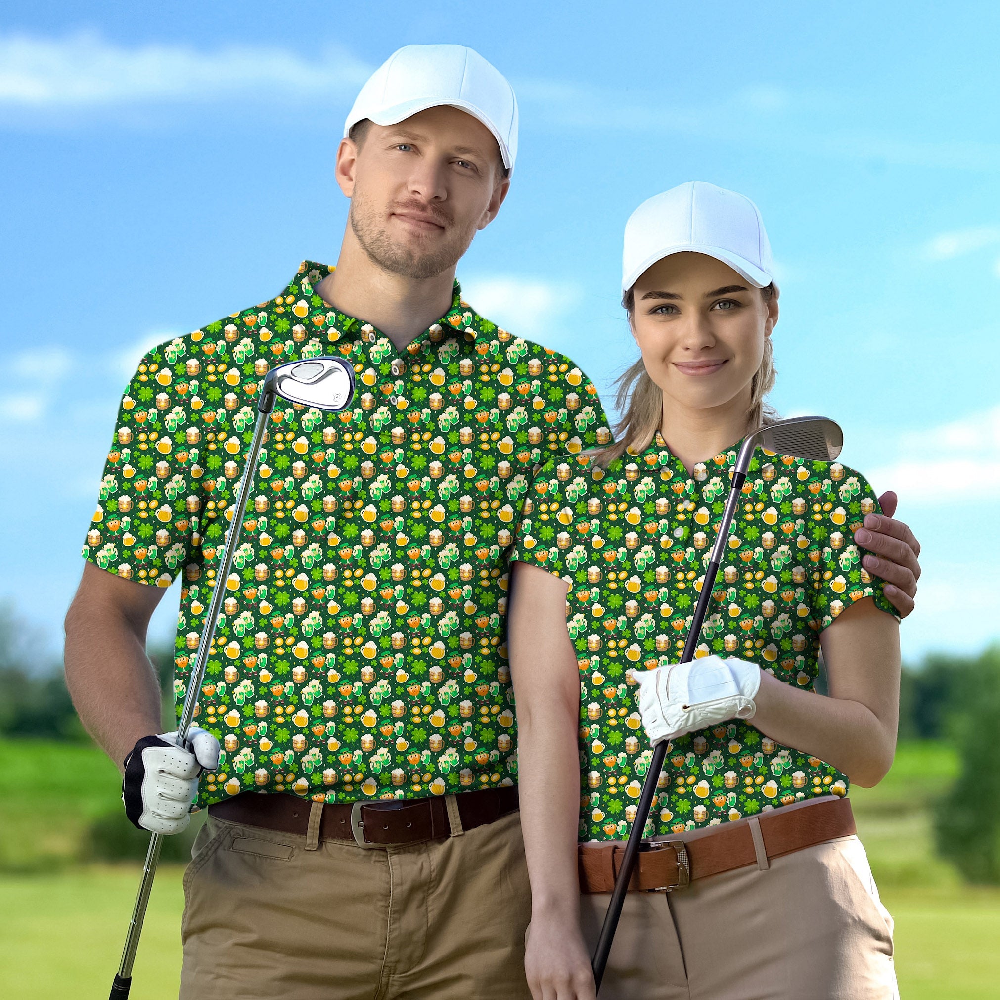 Couple wearing green beer and clover leaf golf polo shirts with white caps holding golf clubs outdoors