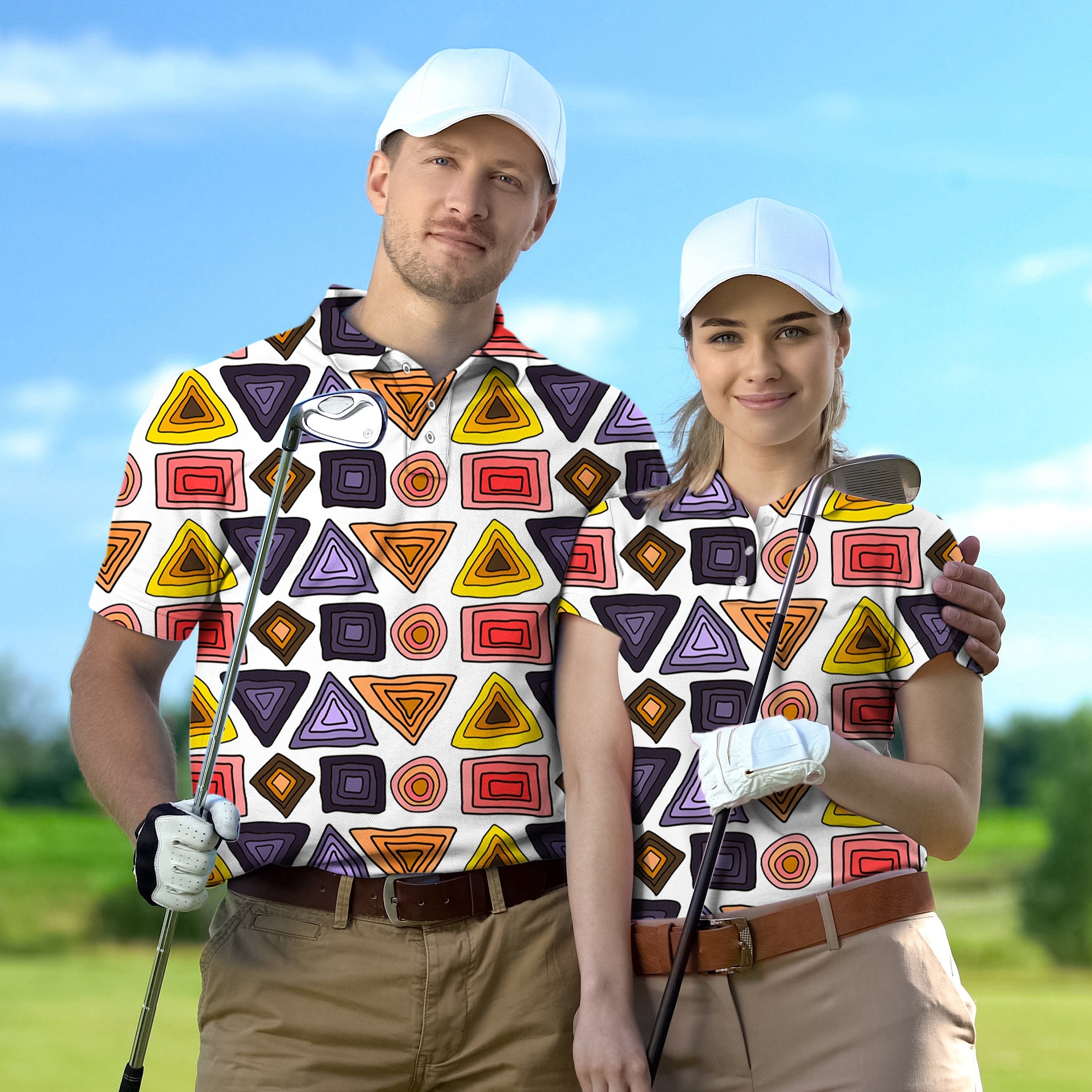 Couple wearing colorful triangle tribal golf shirts holding clubs on golf course