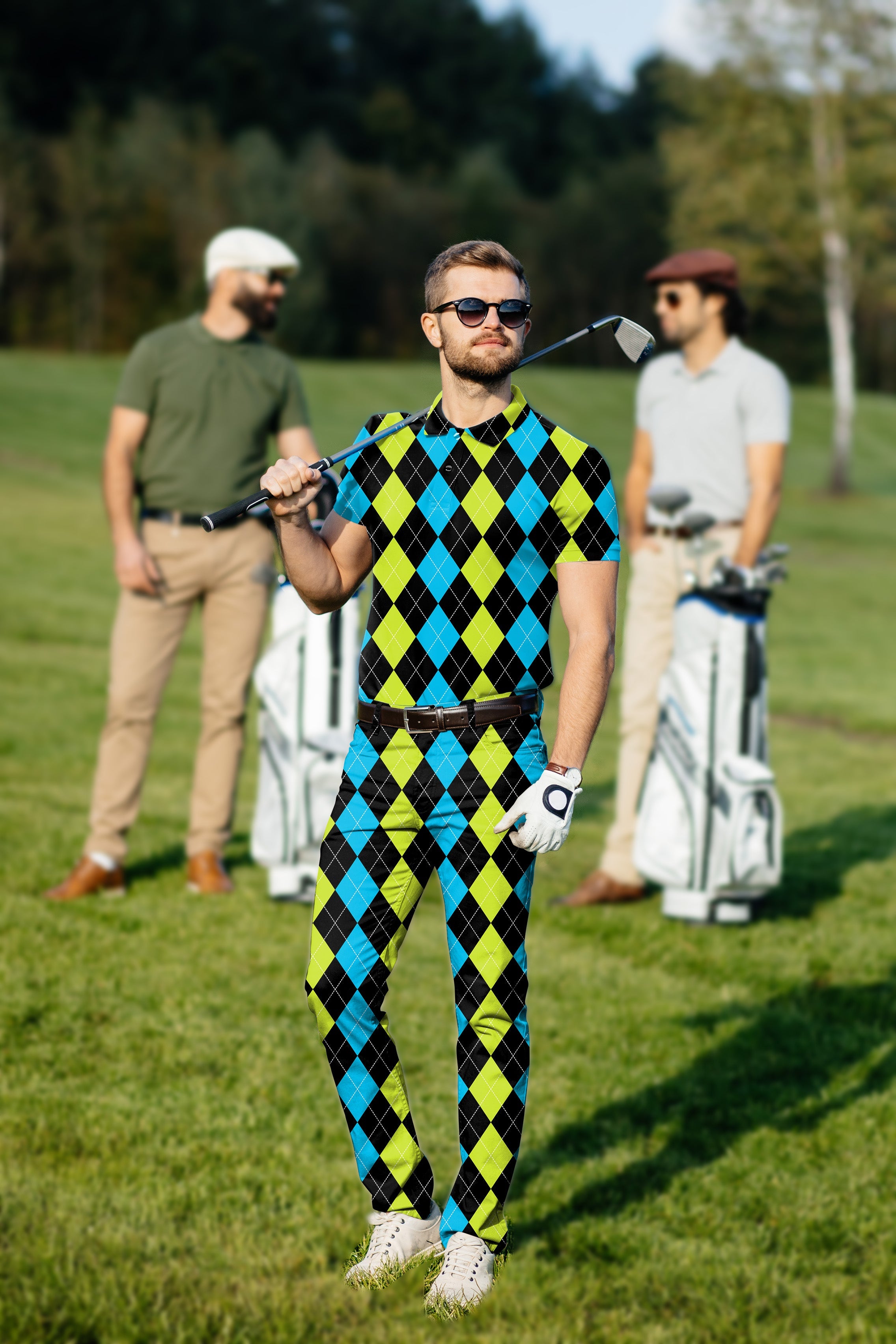 Men's golf set with black green blue argyle polo and pants on golf course