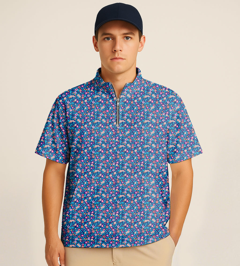 Male model wearing blue floral half zipper turtleneck golf short sleeve shirt with dark floral embroidery