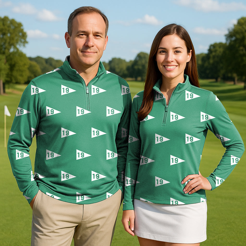 Couple wearing 19th hole-38 green golf active 3/4 zip tops with long sleeves on golf course