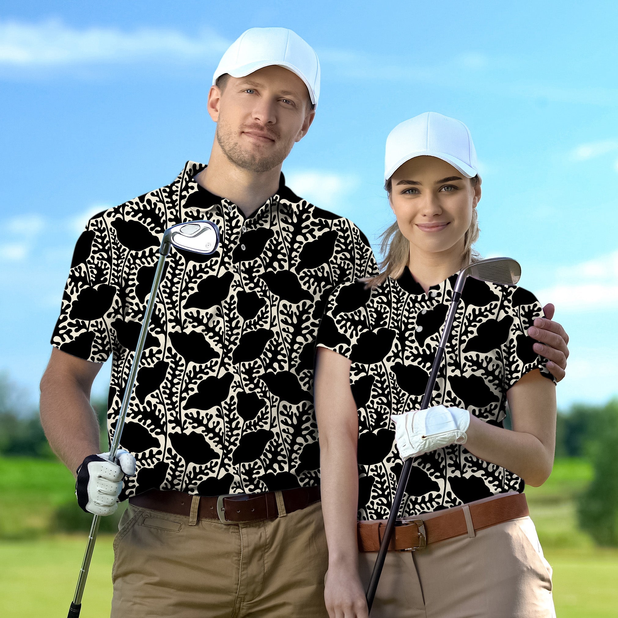 Couple wearing monochrome bloom set golf shirts with white caps holding golf clubs on course