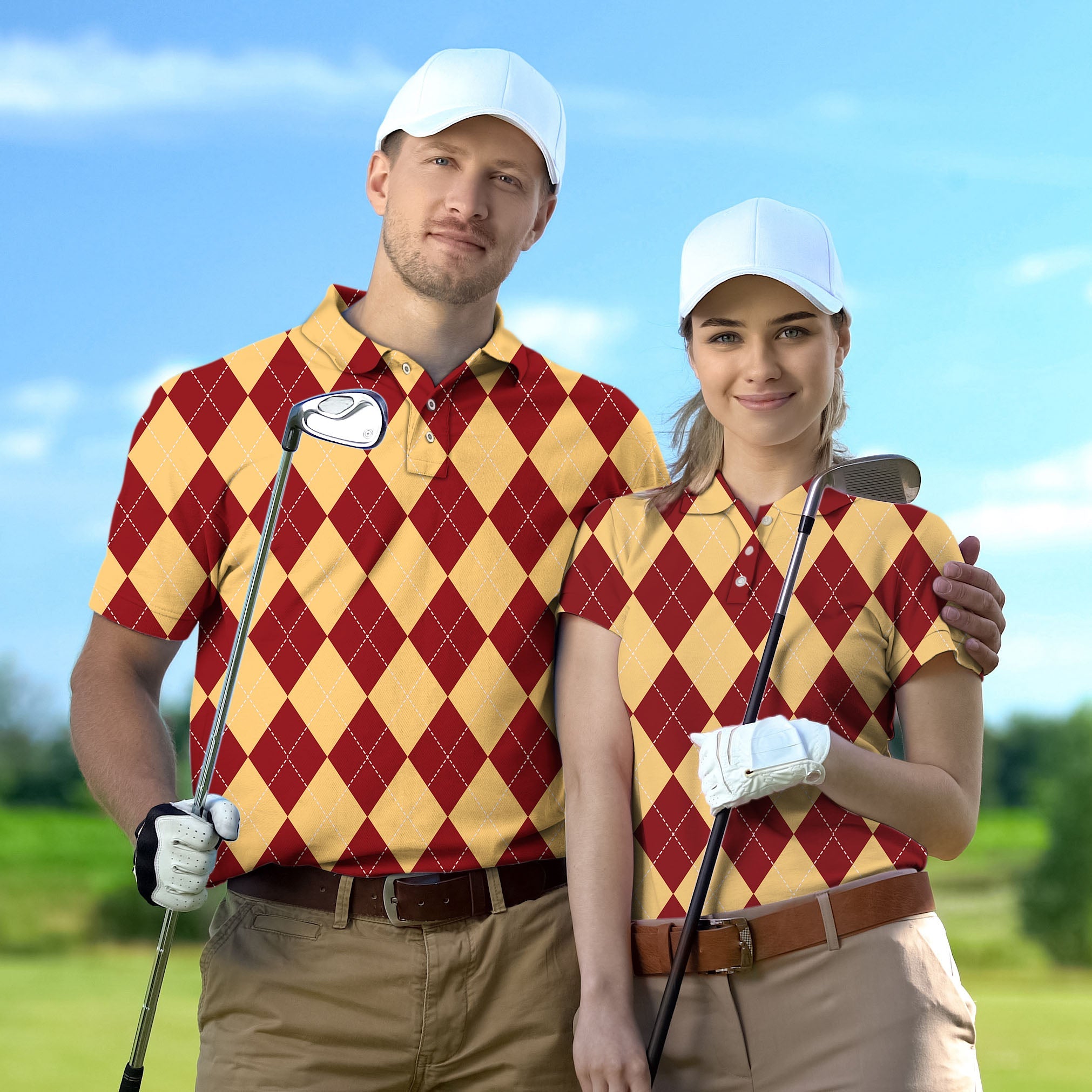Couple wearing yellow and red argyle golf shirts with white caps on golf course
