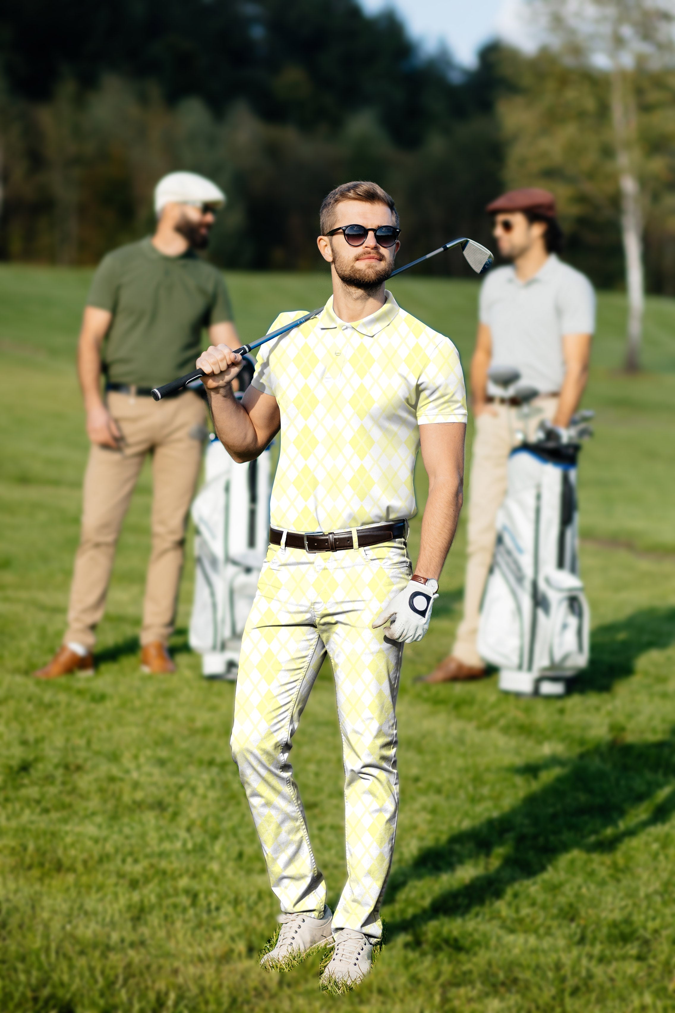 Men's golf set polo and pants in yellow argyle grid pattern on golfer at course