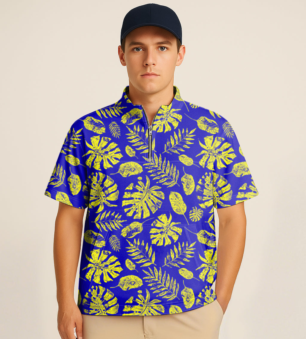 Male model wearing a blue half zipper turtleneck golf shirt with yellow tropical plant embroidery and short sleeves