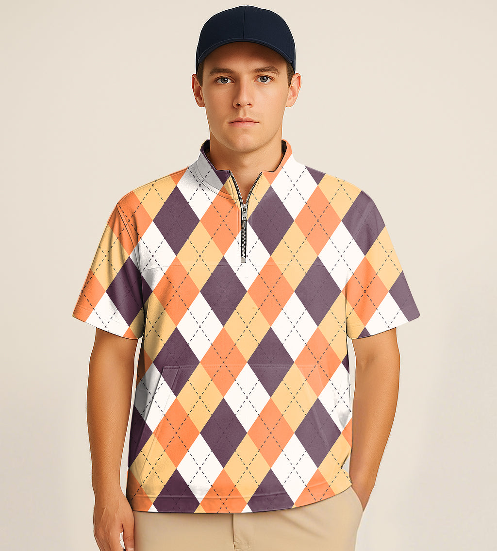 Man wearing half zipper turtleneck golf shirt with orange white and brown argyle embroidery