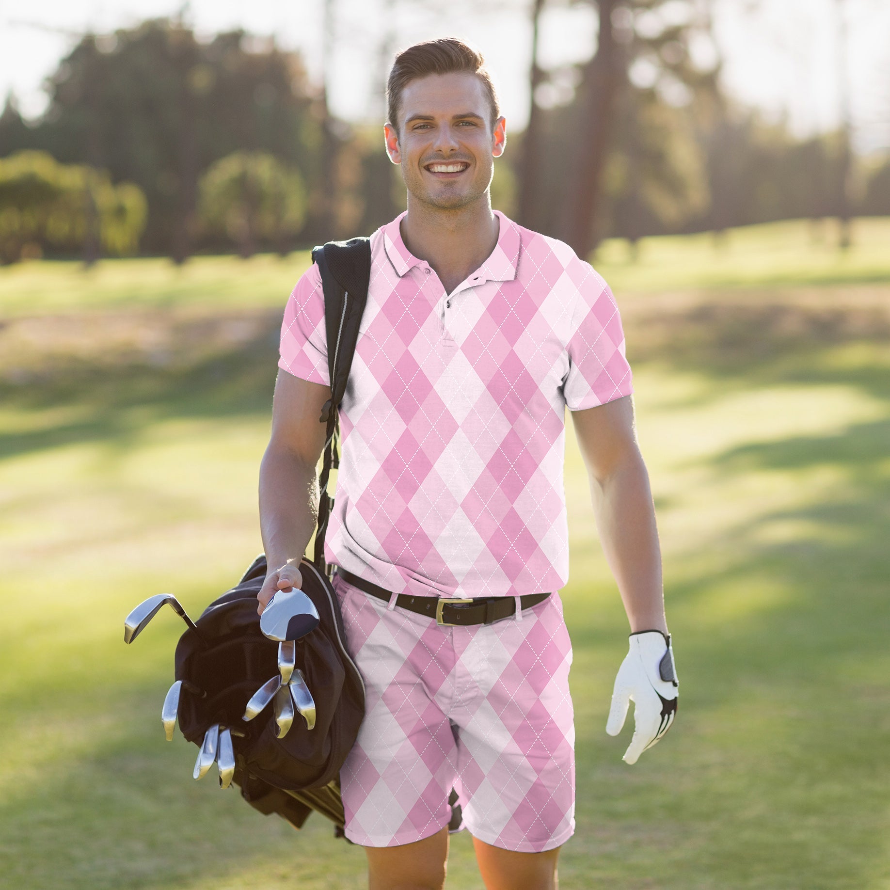 Men's golf set in pink argyle pattern with polo shirt and shorts, featuring moisture-wicking, four-way stretch fabric and UPF 40+ protection.