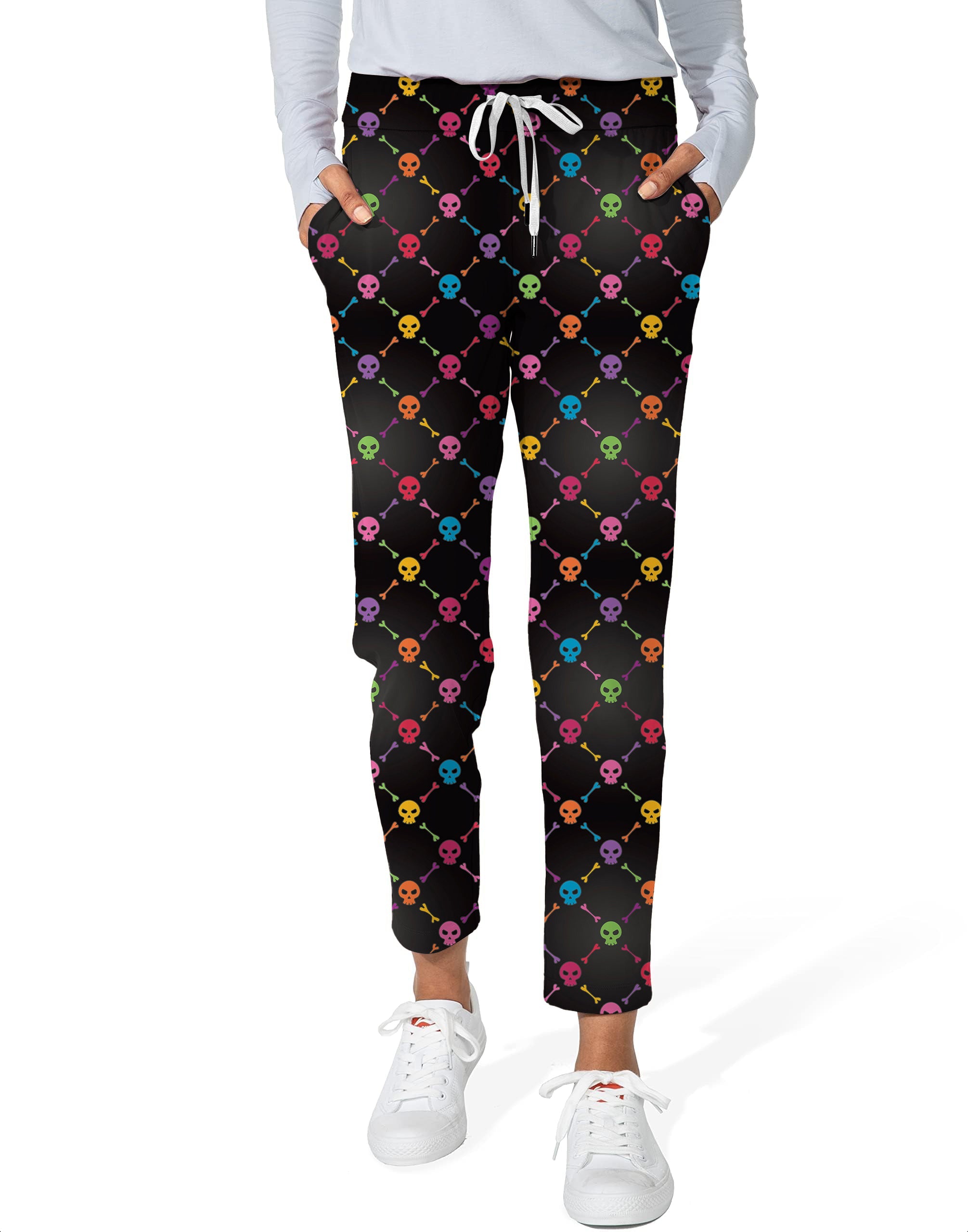 Women's 7/8 stretch ankle golf pants with Halloween colors skull bones pattern on black background