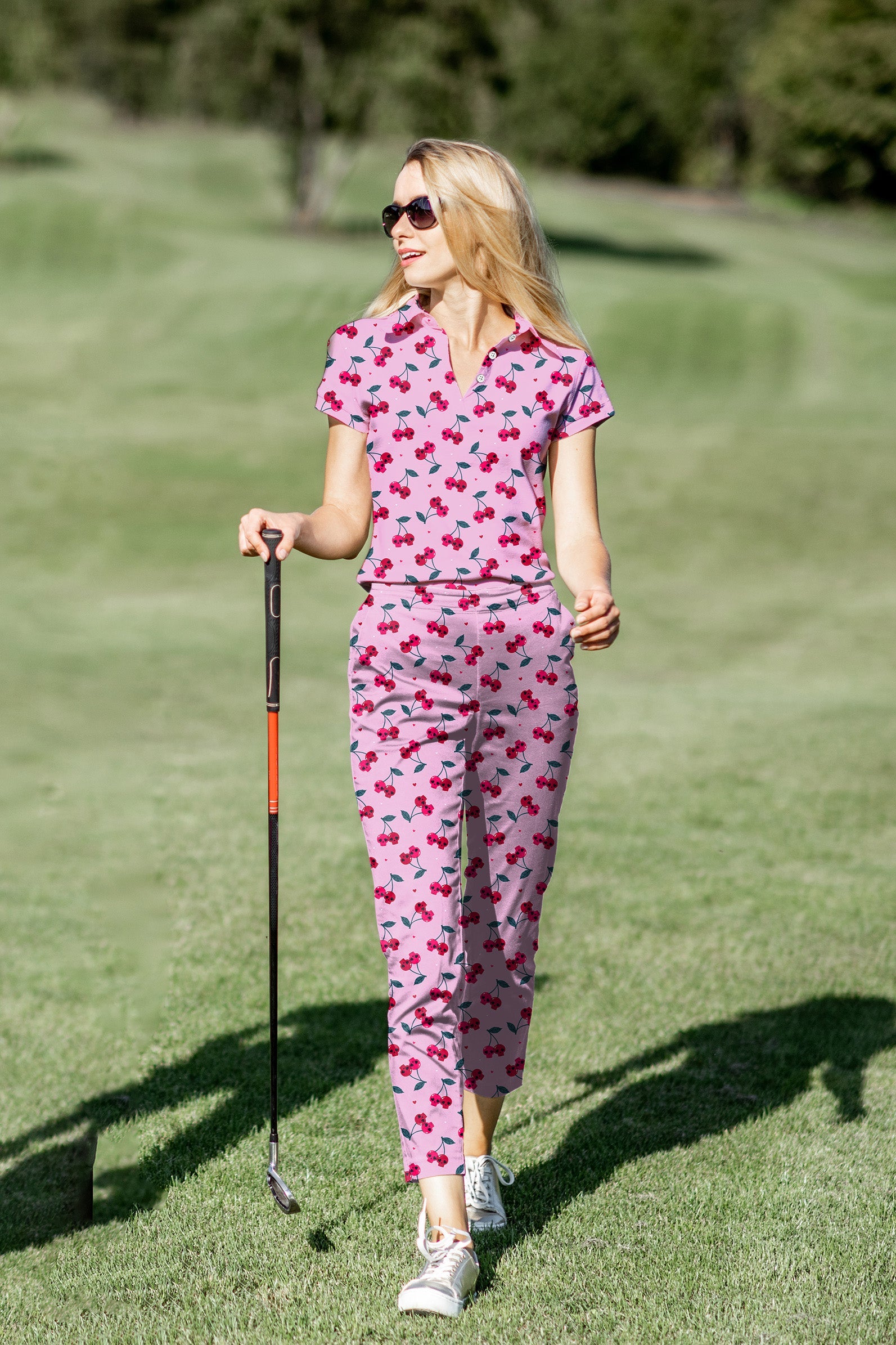 Women's golf polo and pants set with Halloween cherry skull pattern, moisture-wicking, stretch fabric, and classic fit