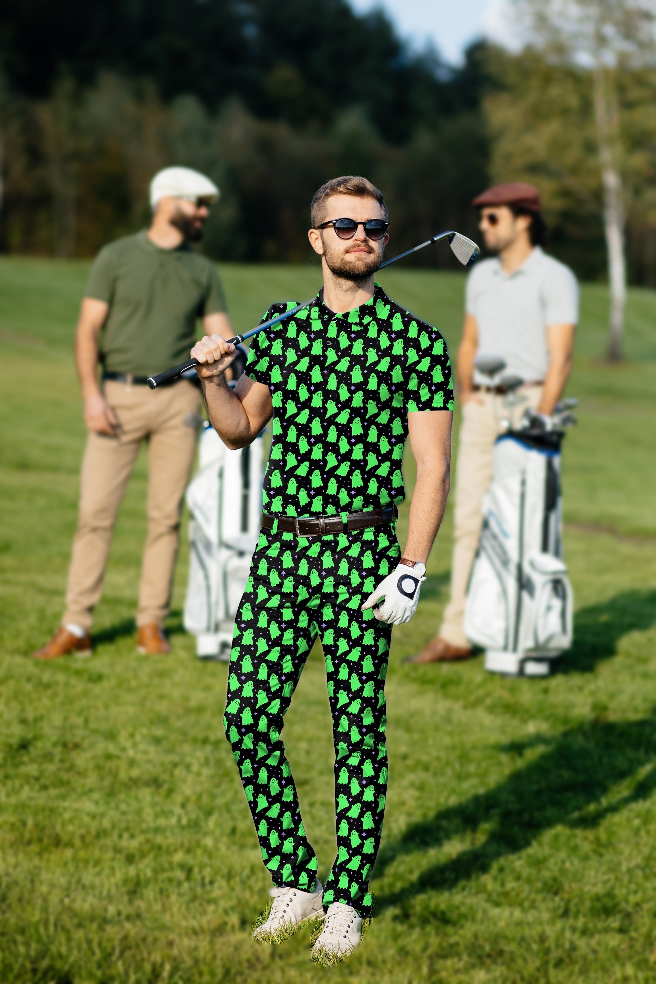 Men's golf set with green ghost pattern polo and pants, four-way stretch, moisture-wicking fabric, wrinkle resistant, UPF 40+ protection, classic fit, and stay-right collar.