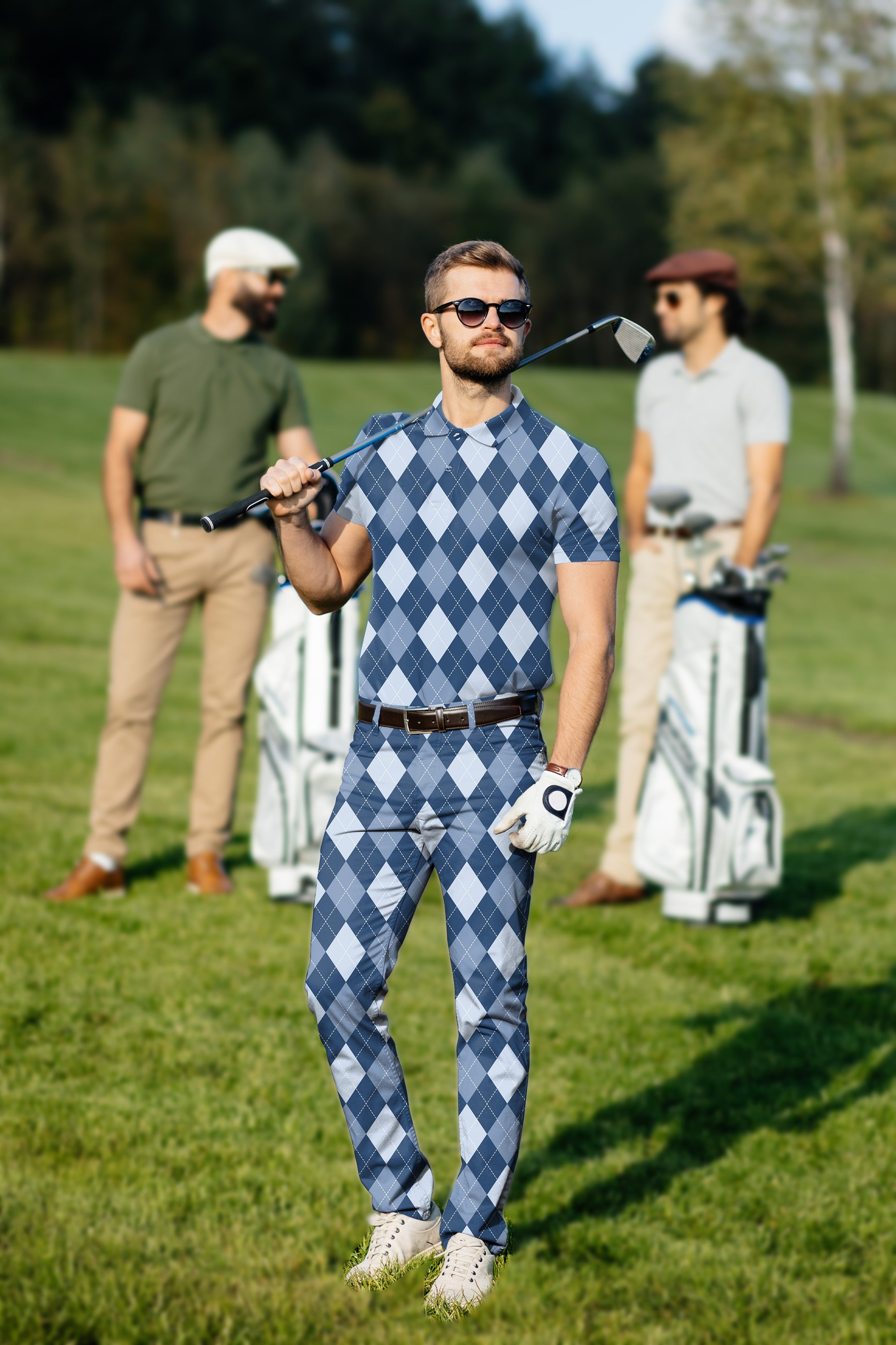 Men's golf set with blue argyle polo and pants, four-way stretch, moisture-wicking, wrinkle-resistant fabric, and UPF 40+ protection.