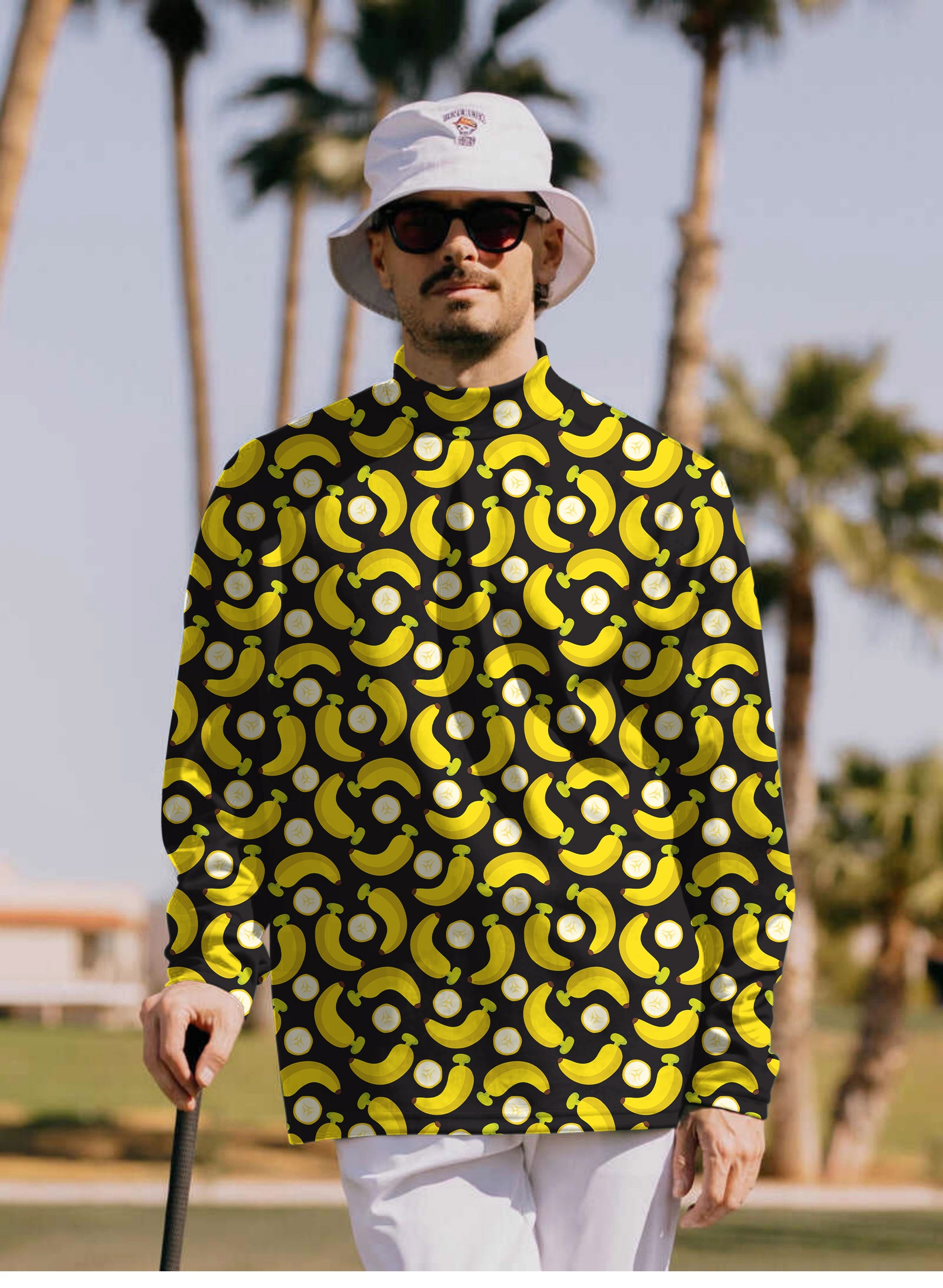 Men's Halloween Bananas pullover T-shirt with yellow banana and peel pattern on black background, high neck, long sleeve design.
