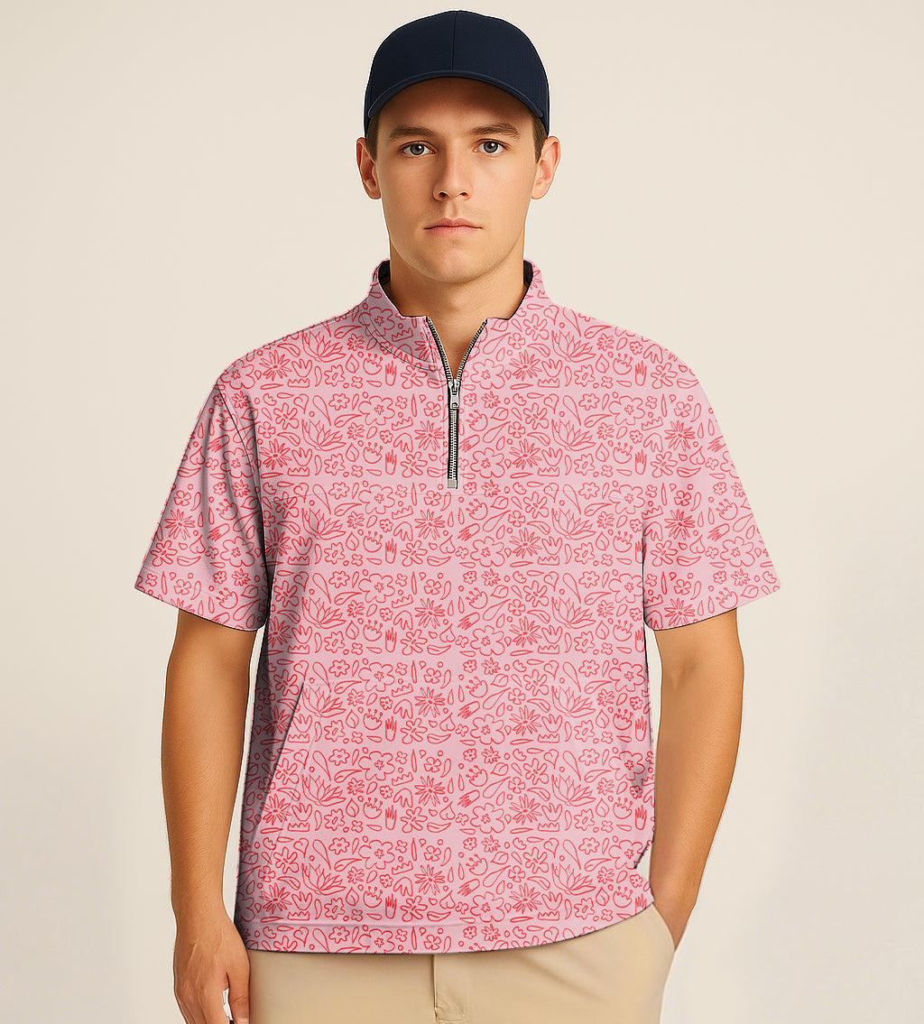 man wearing pink half zipper turtleneck golf short shirt with floral embroidery and navy cap
