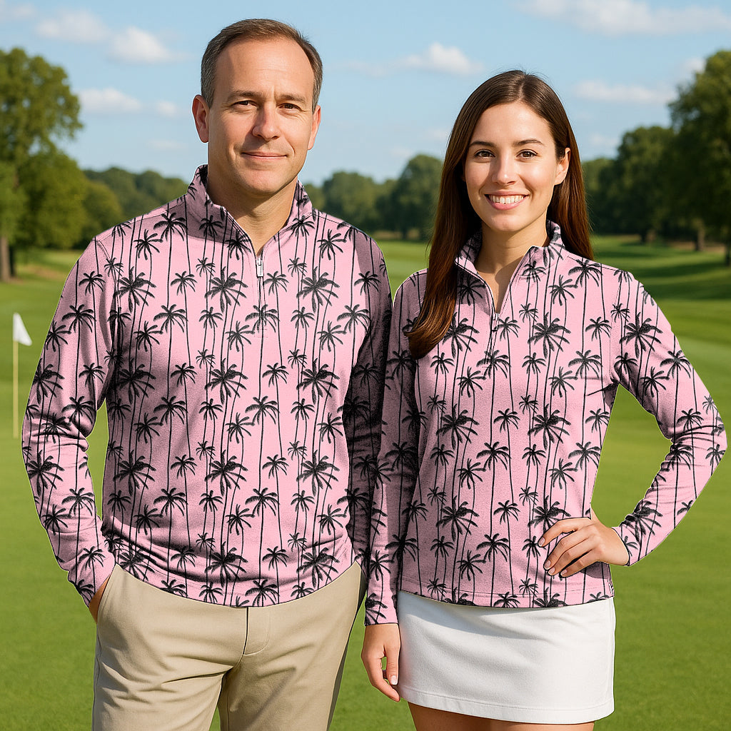 Miami Palms couple wearing matching pink palm tree print 3/4 zip golf tops on a sunny golf course